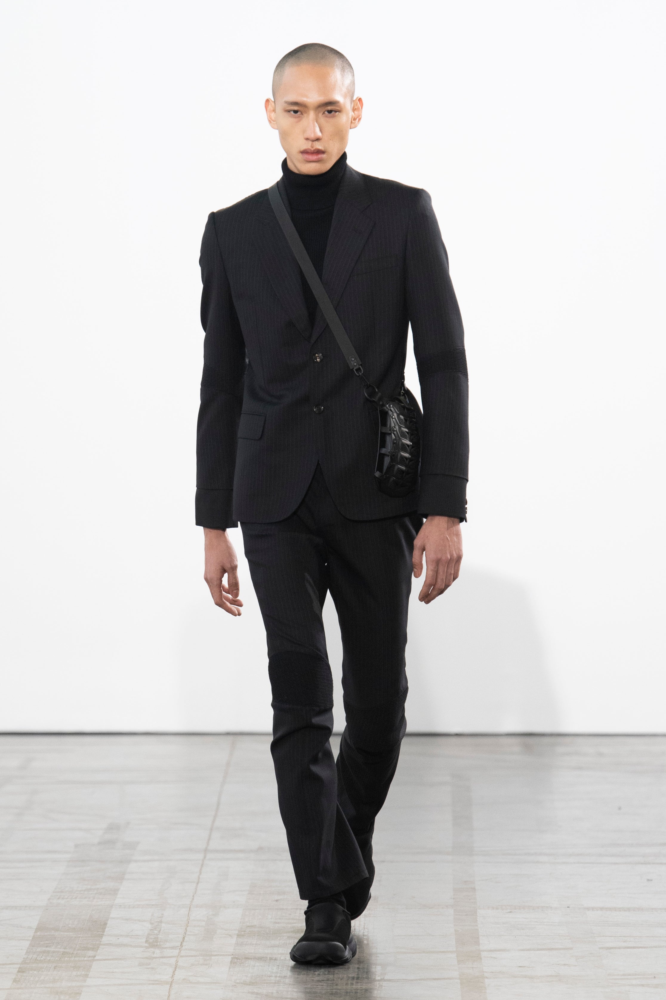 Fashion model wearing a Junya Watanabe Man outfit