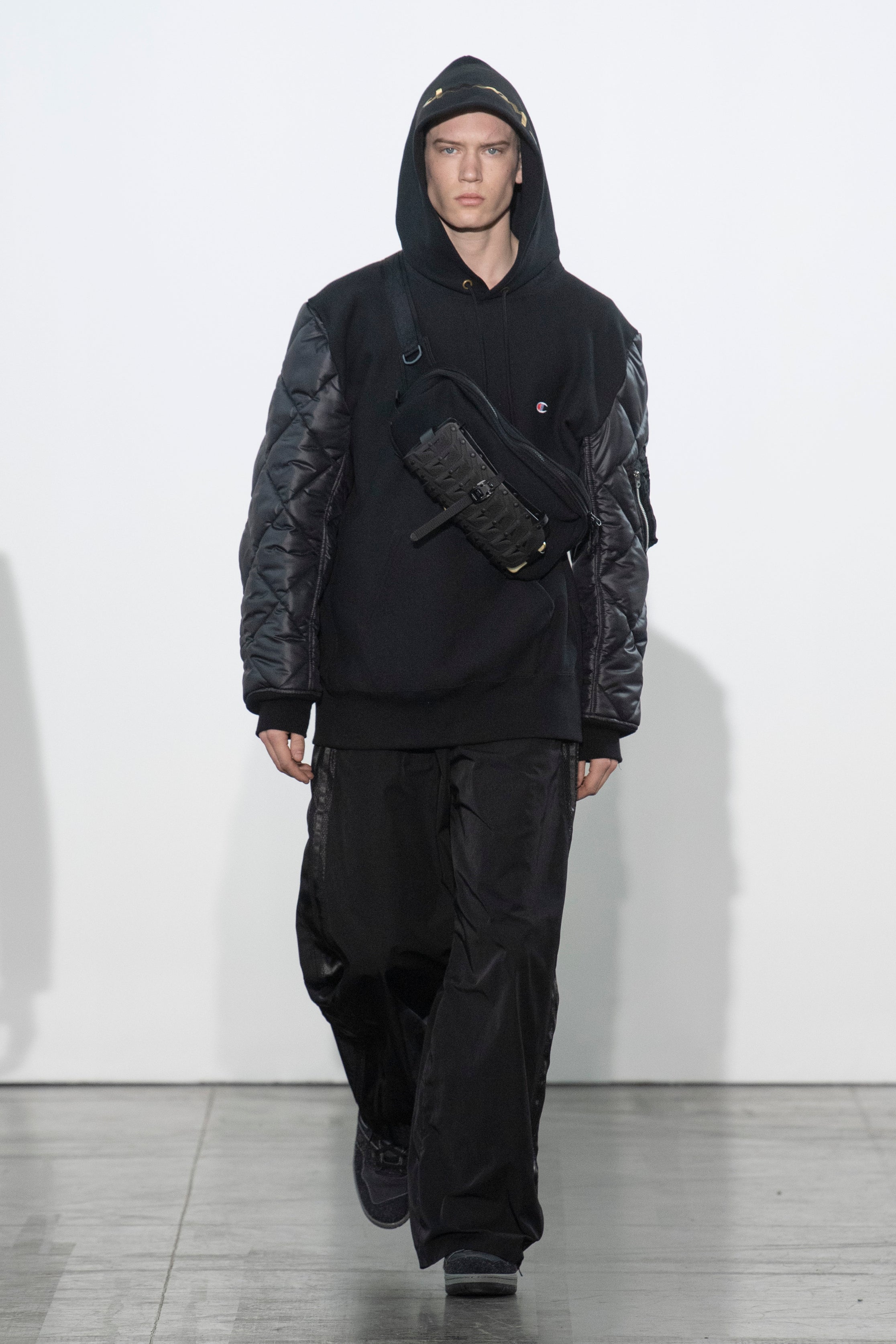 Fashion model wearing a Junya Watanabe Man outfit