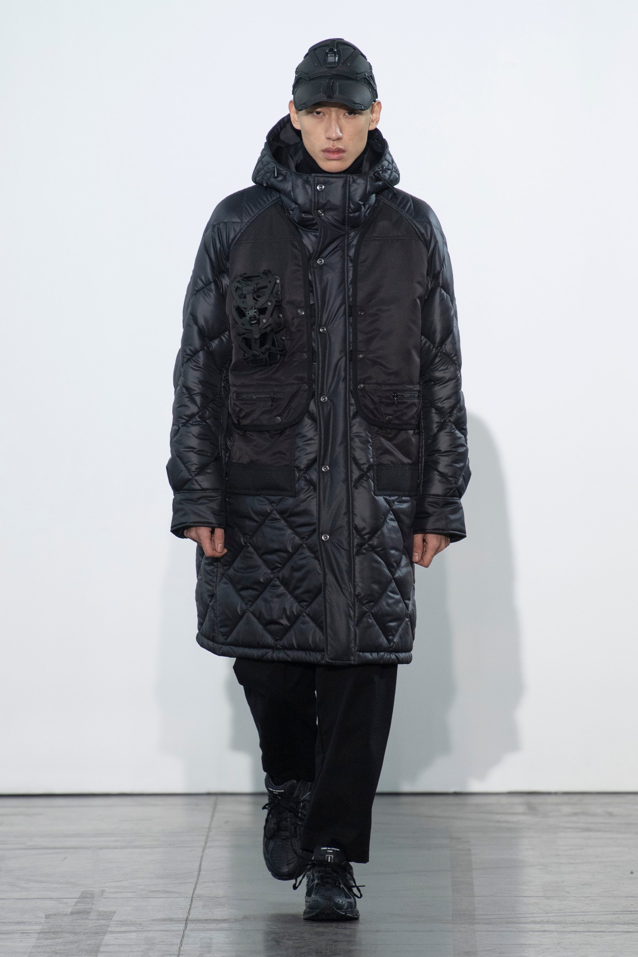 Fashion model wearing a Junya Watanabe Man outfit
