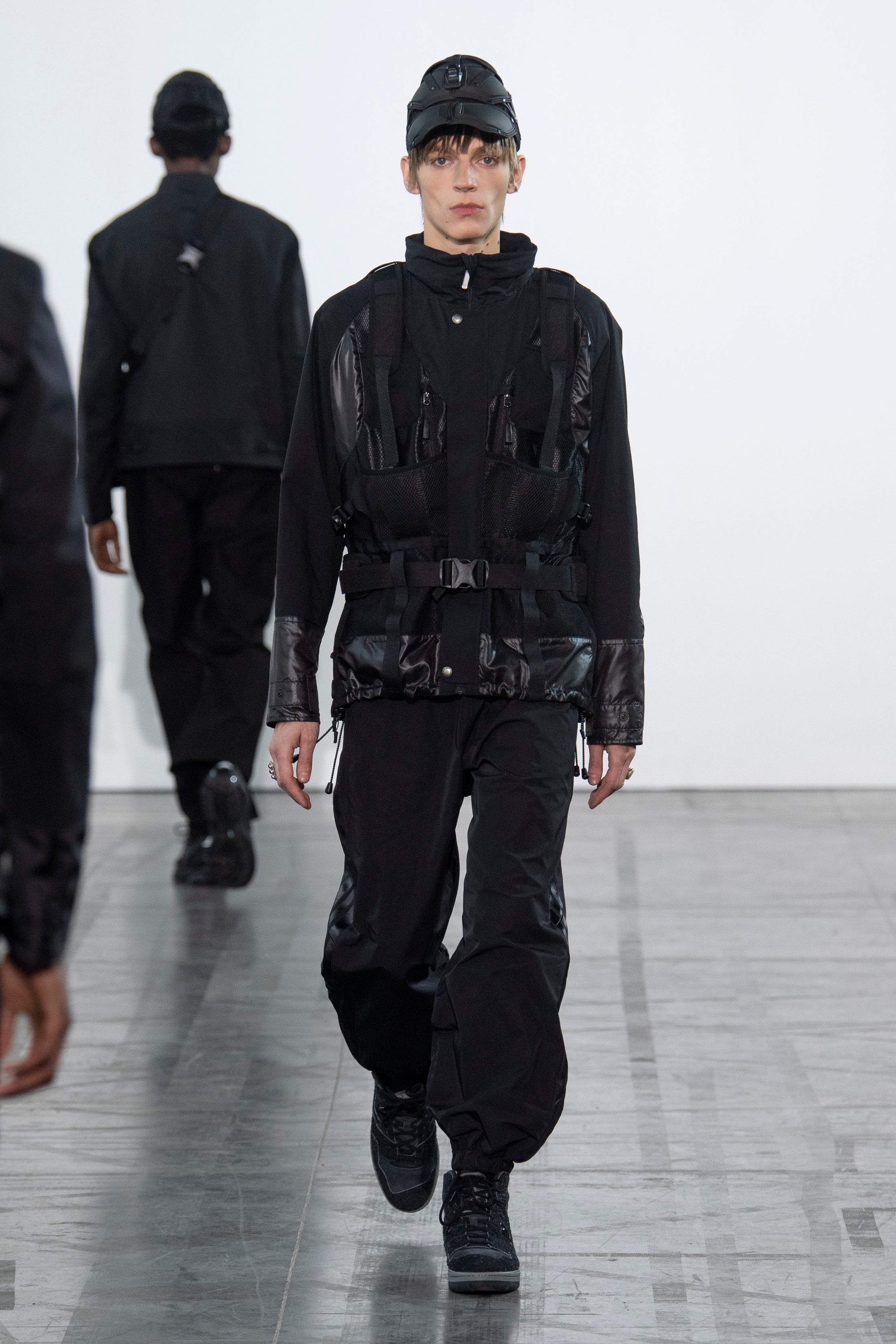 Fashion model wearing a Junya Watanabe Man outfit