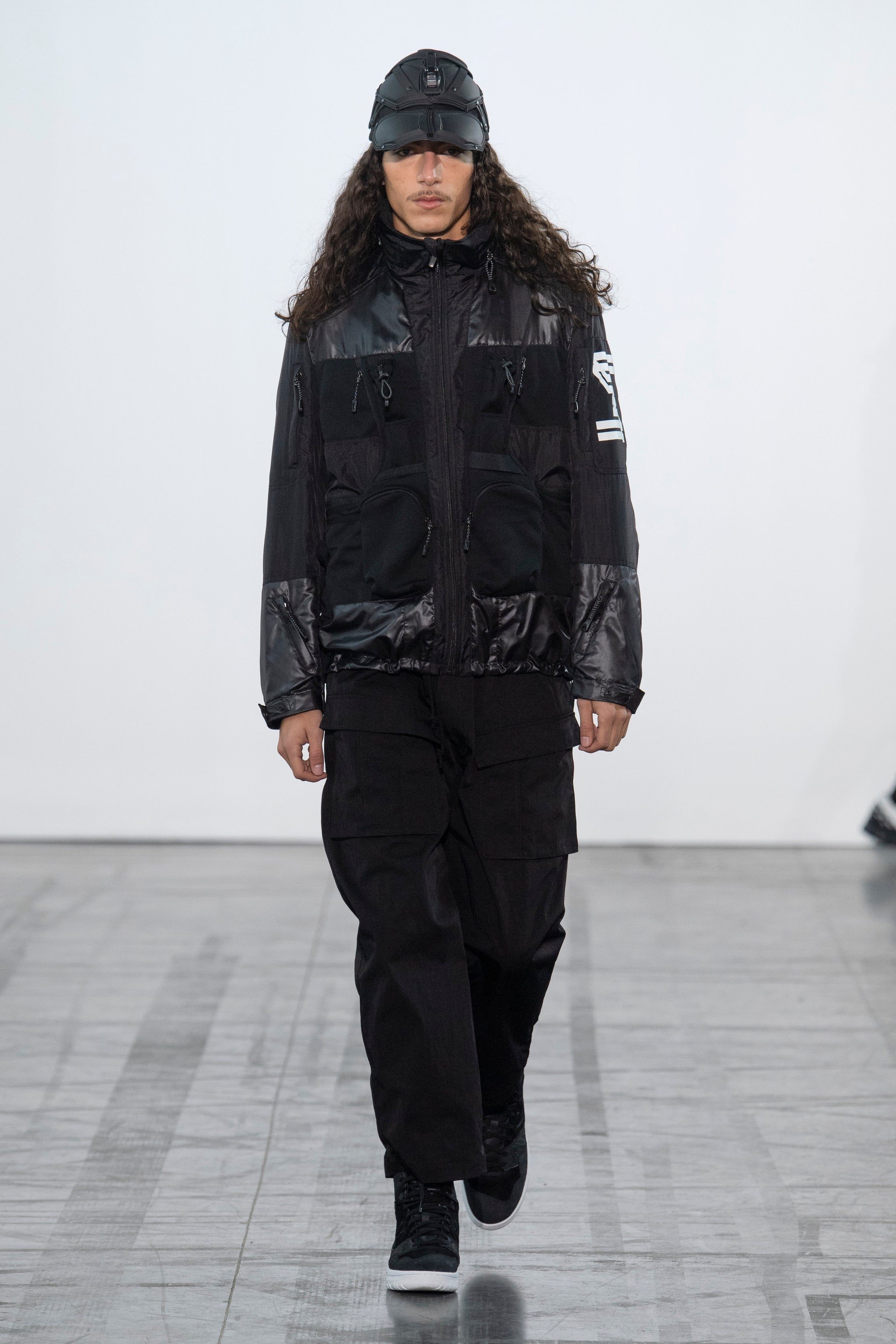Fashion model wearing a Junya Watanabe Man outfit