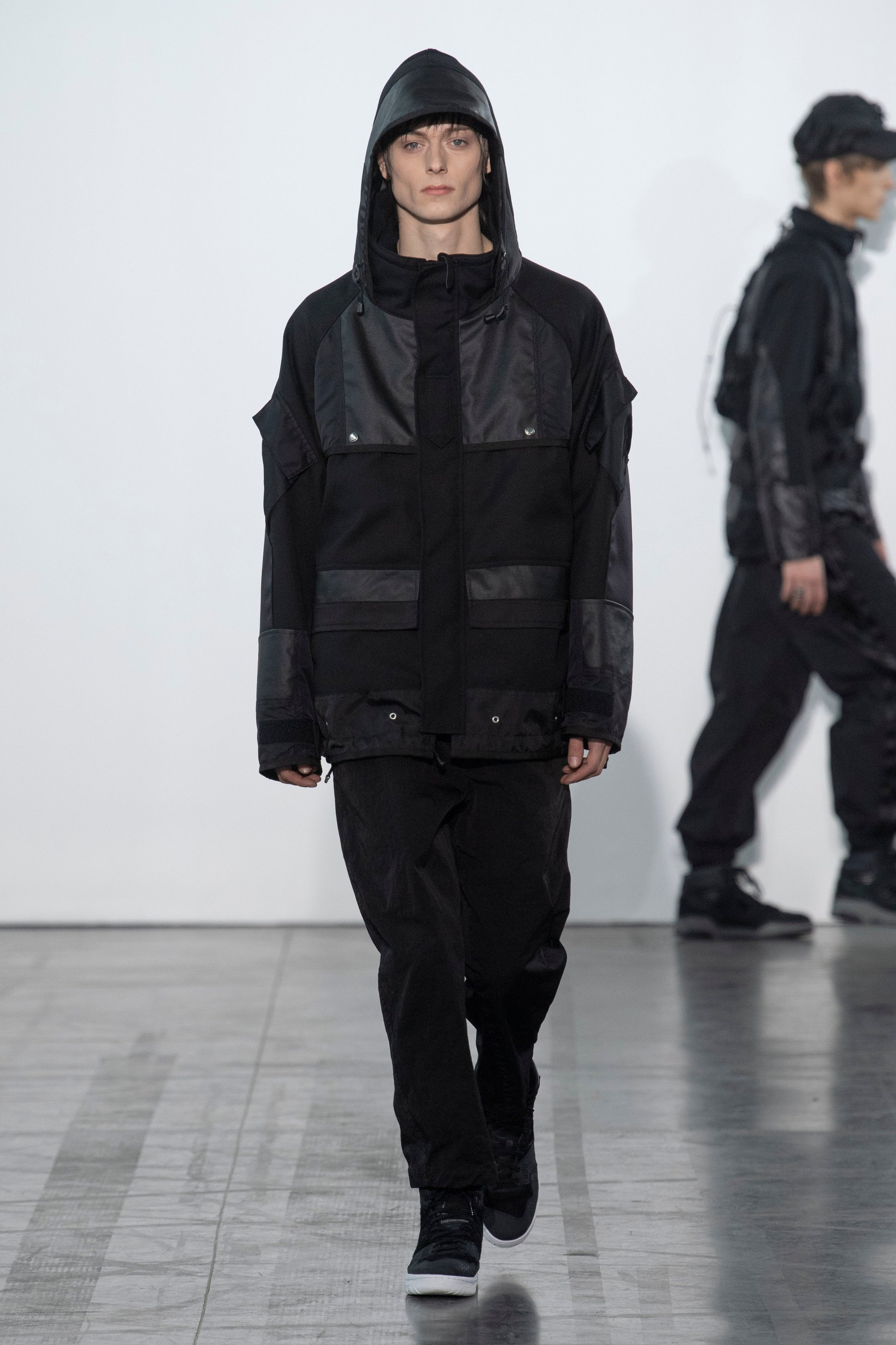 Fashion model wearing a Junya Watanabe Man outfit