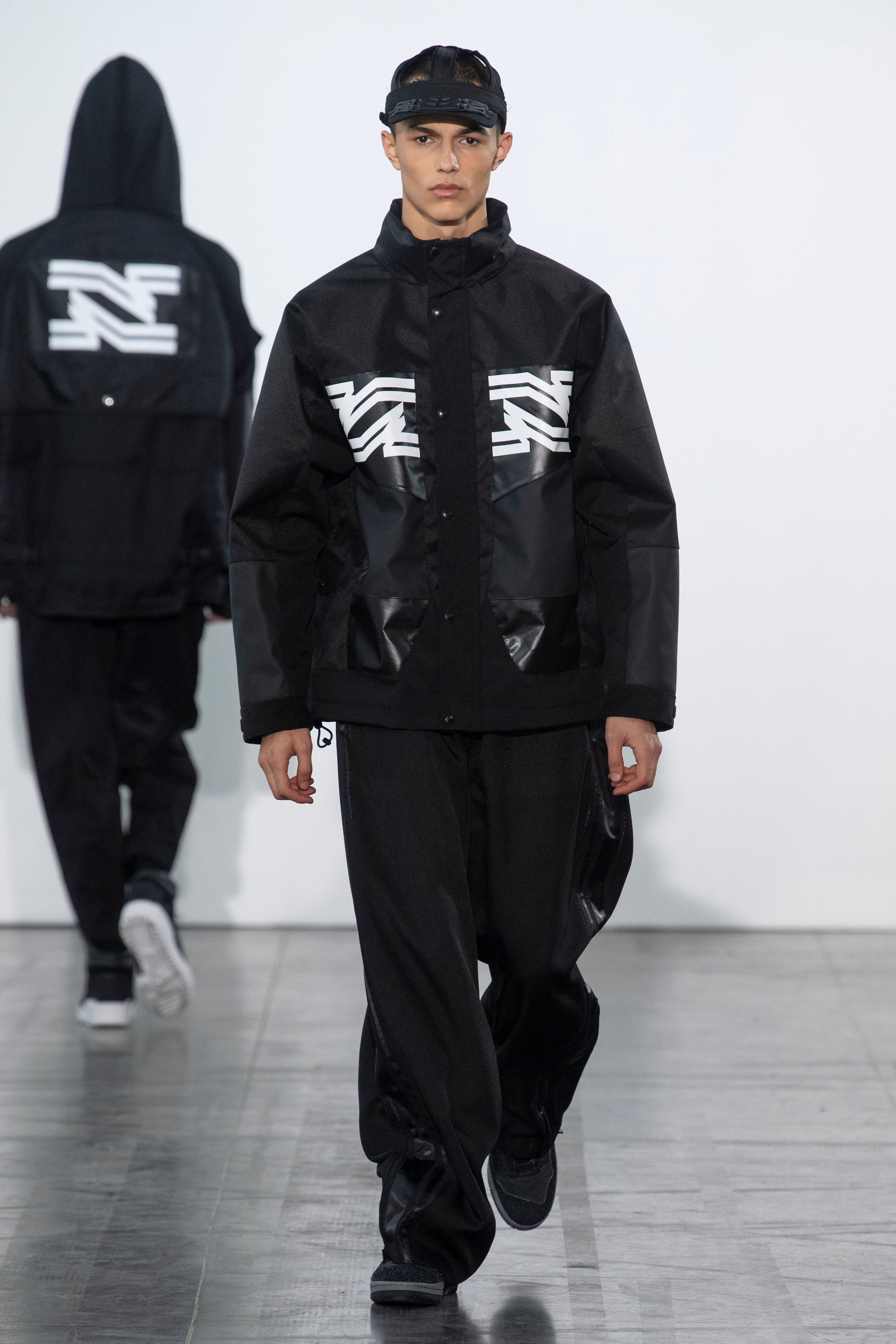 Fashion model wearing a Junya Watanabe Man outfit