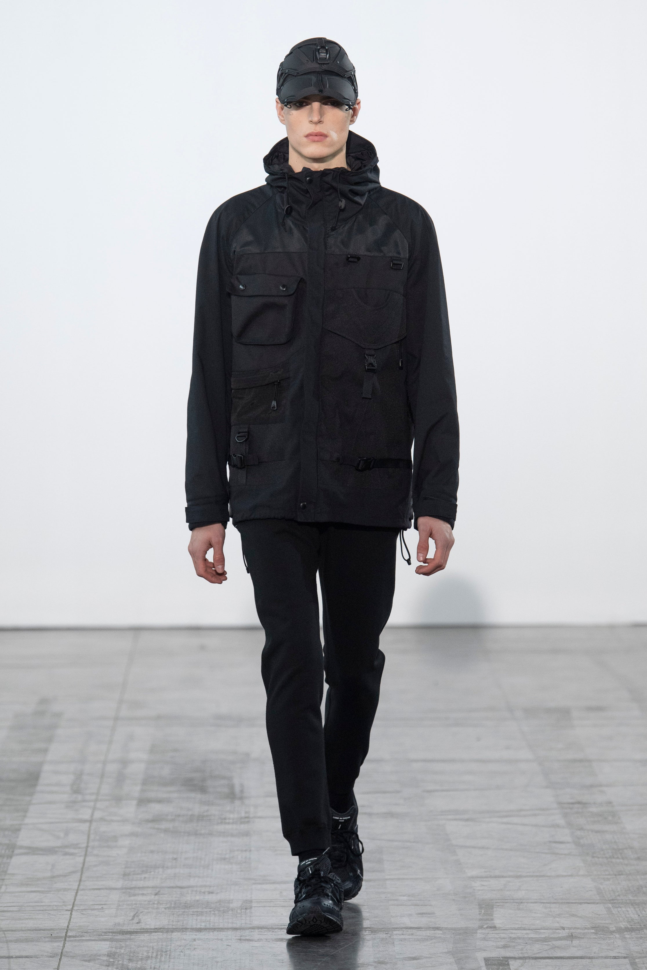 Fashion model wearing a Junya Watanabe Man outfit