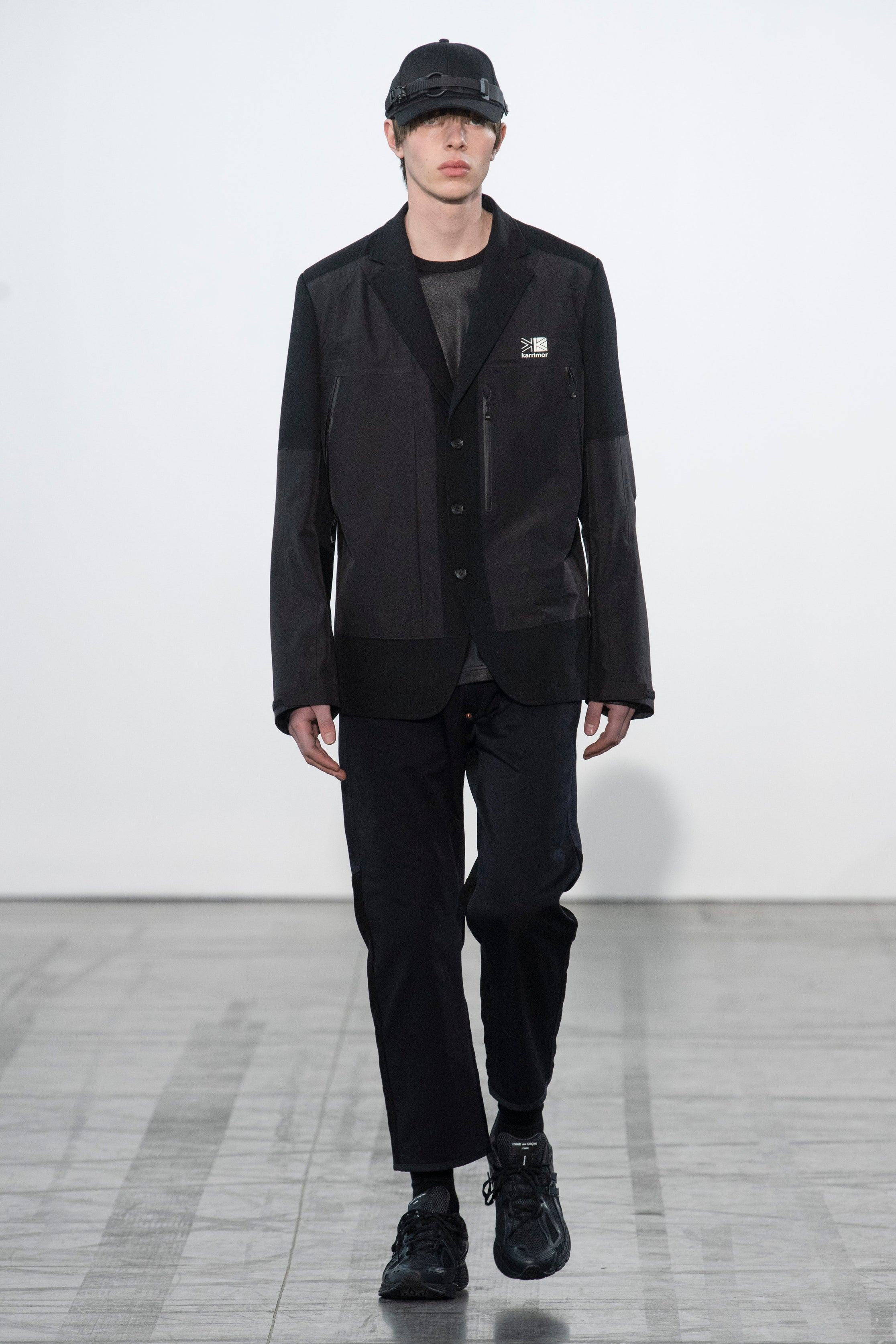 Fashion model wearing a Junya Watanabe Man outfit