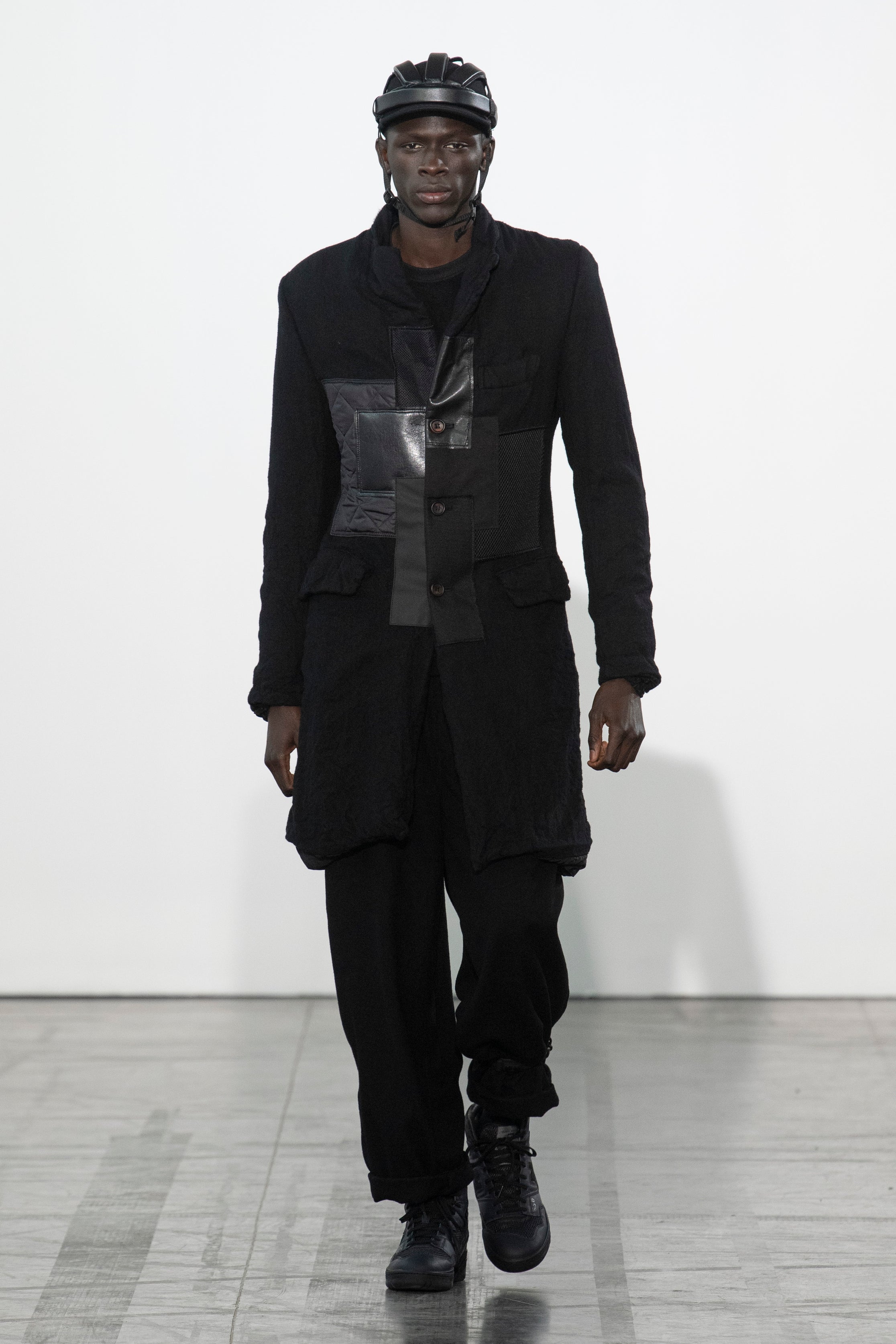 Fashion model wearing a Junya Watanabe Man outfit
