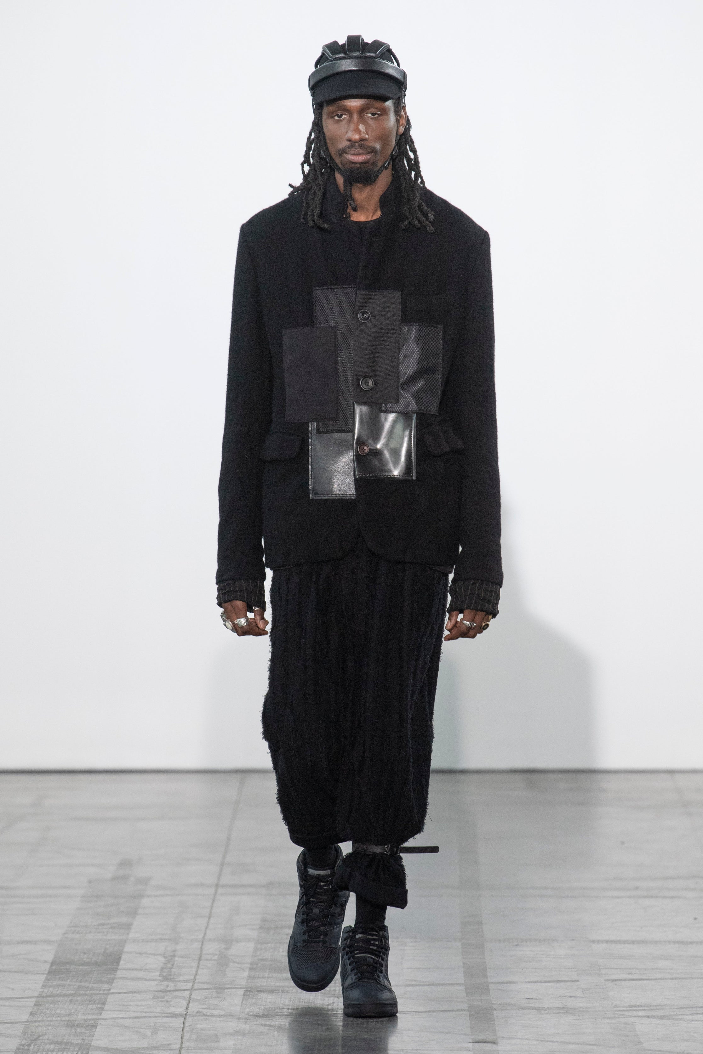 Fashion model wearing a Junya Watanabe Man outfit