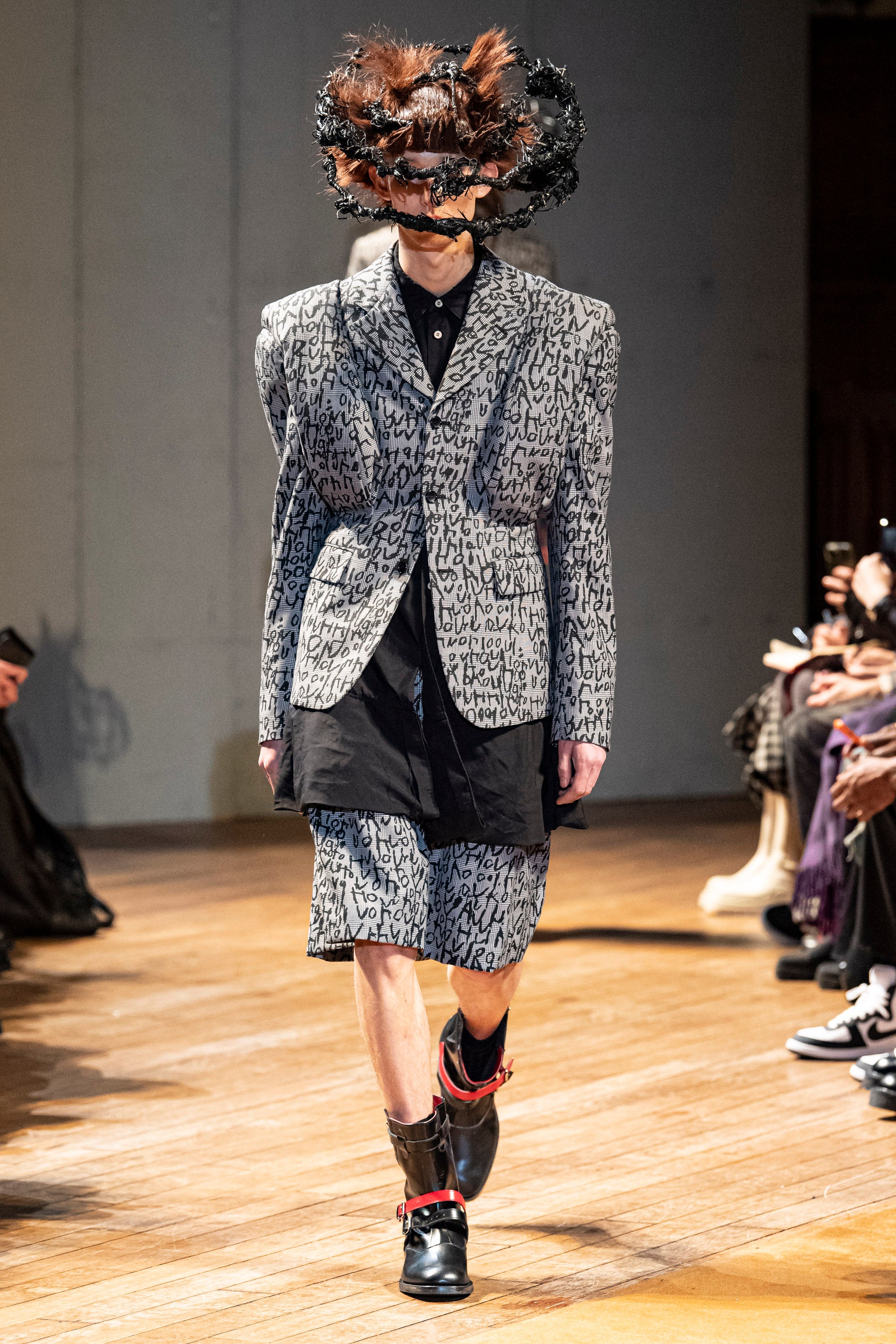 Fashion model wearing a Comme des Garçons Homme Plus outfit