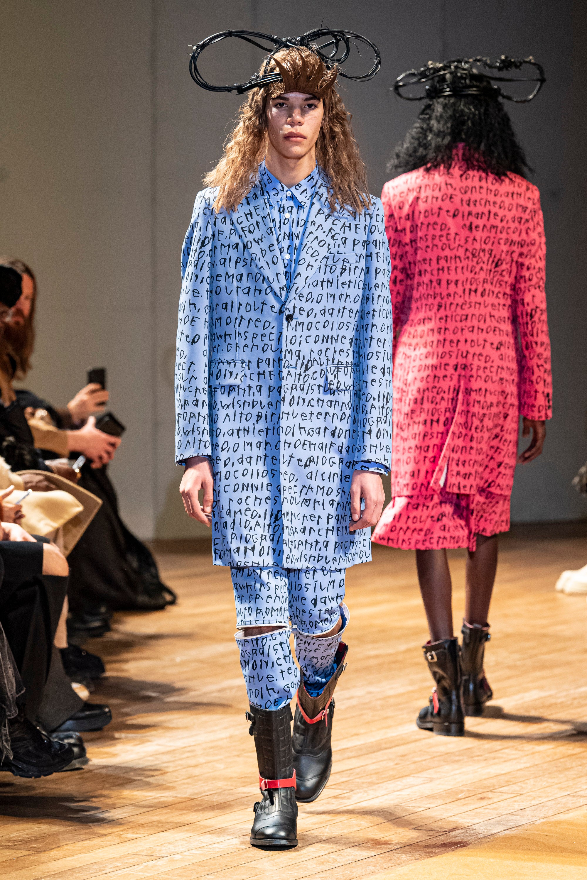 Fashion model wearing a Comme des Garçons Homme Plus outfit