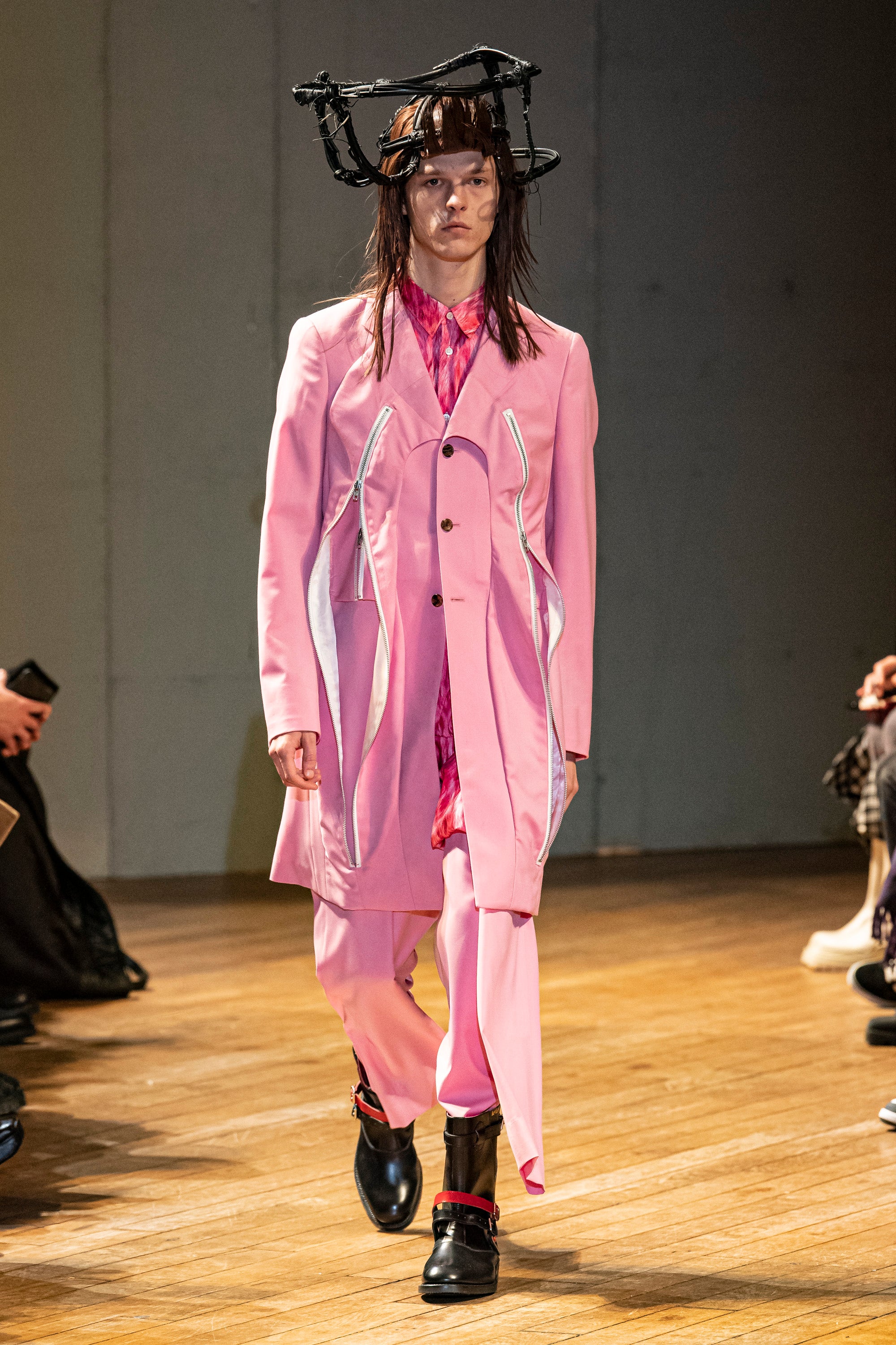 Fashion model wearing a Comme des Garçons Homme Plus outfit