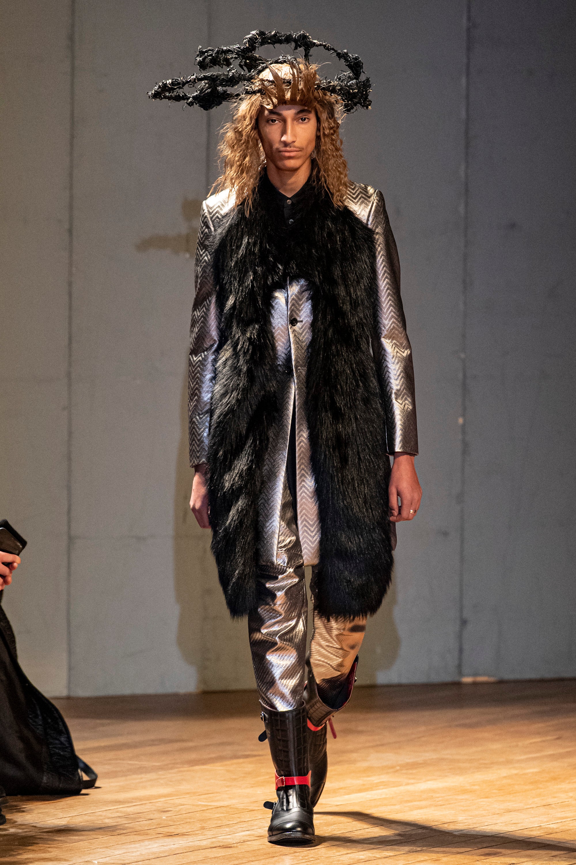 Fashion model wearing a Comme des Garçons Homme Plus outfit