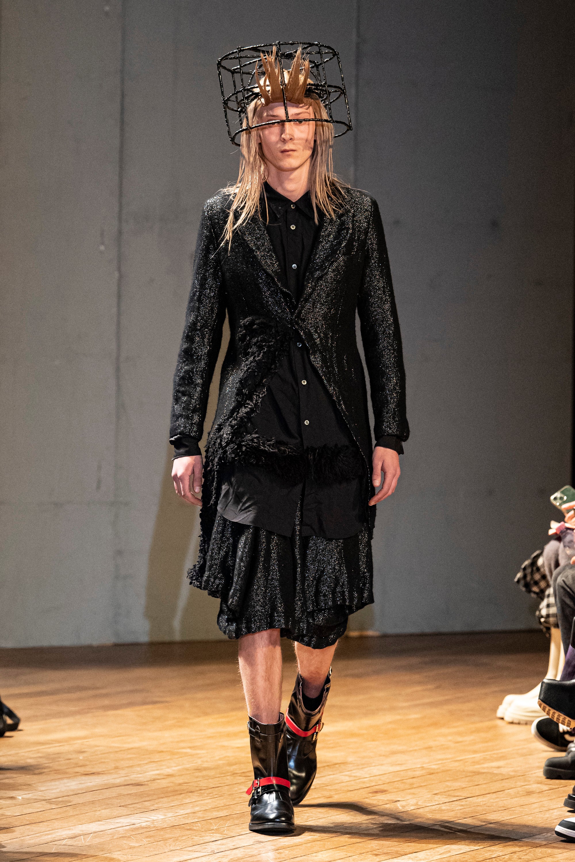 Fashion model wearing a Comme des Garçons Homme Plus outfit