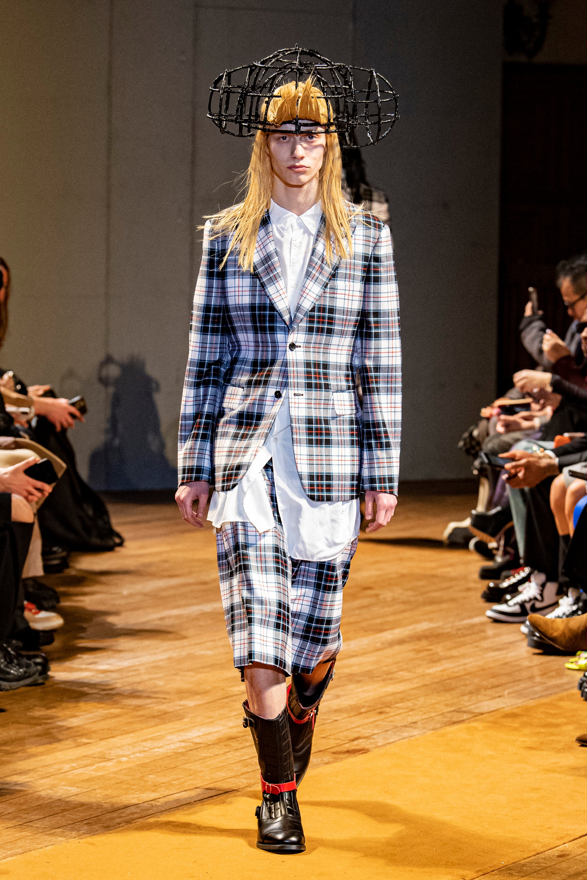 Fashion model wearing a Comme des Garçons Homme Plus outfit