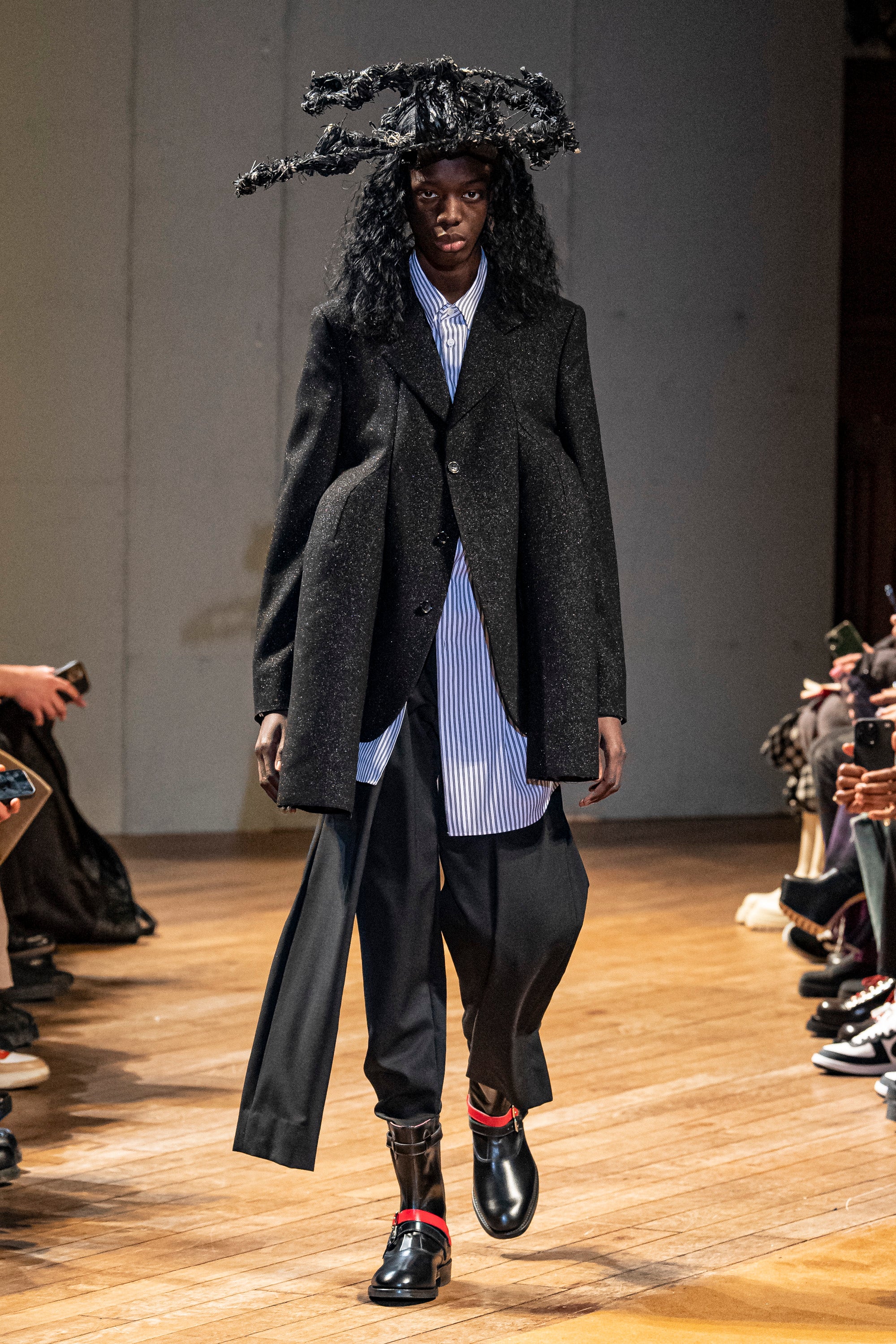 Fashion model wearing a Comme des Garçons Homme Plus outfit