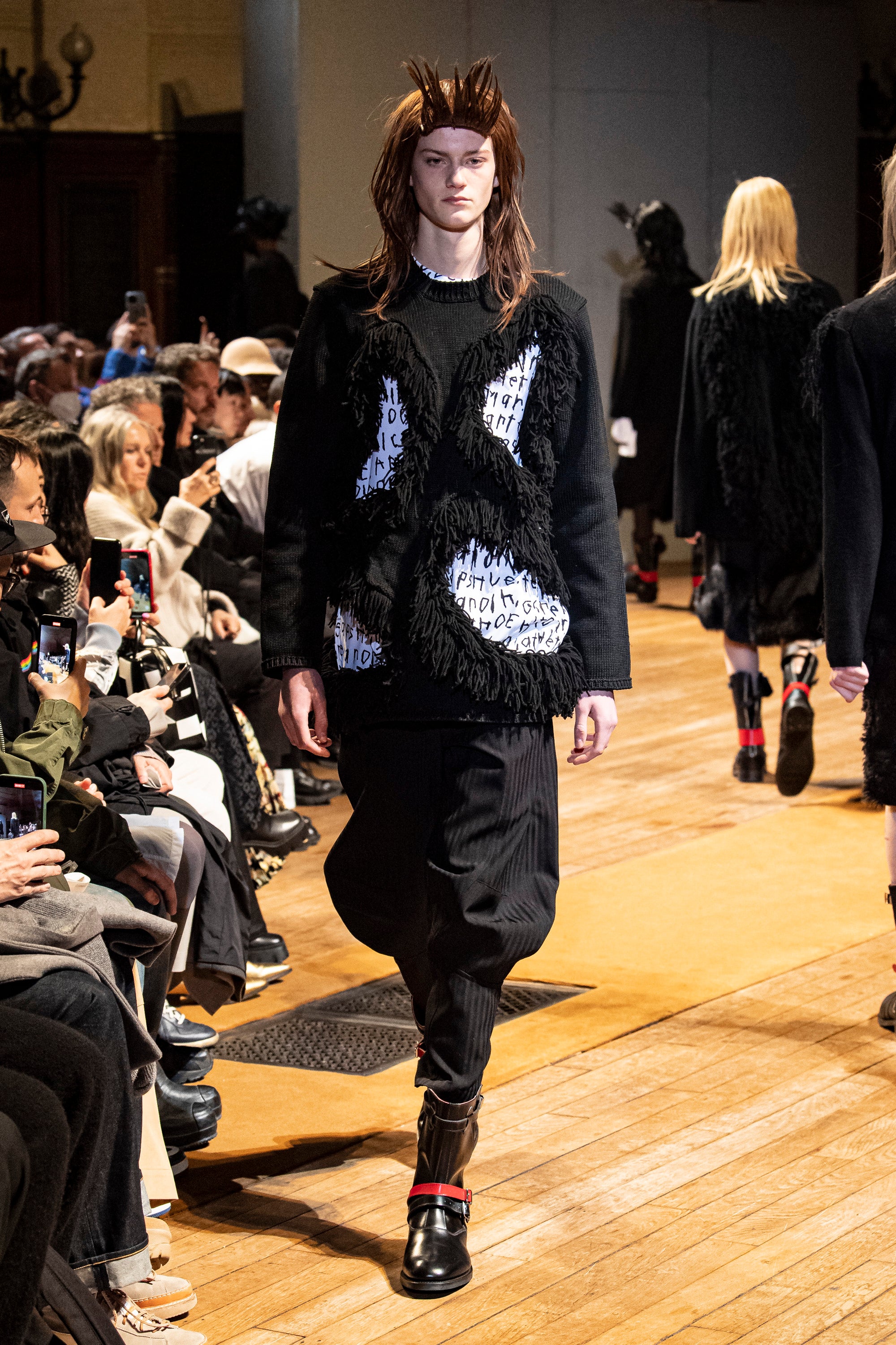 Fashion model wearing a Comme des Garçons Homme Plus outfit