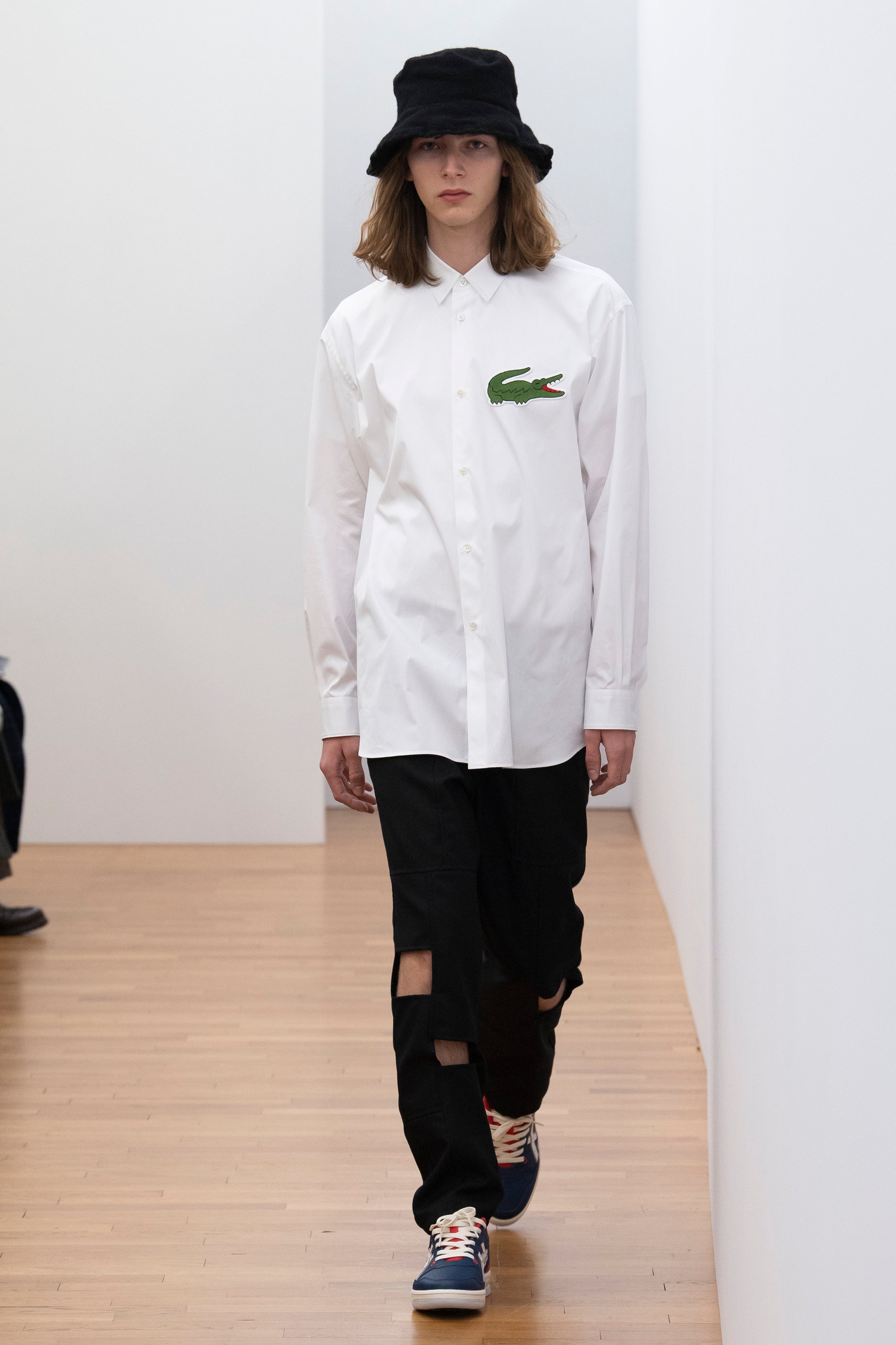 Fashion model wearing a Comme des Garçons Shirt outfit