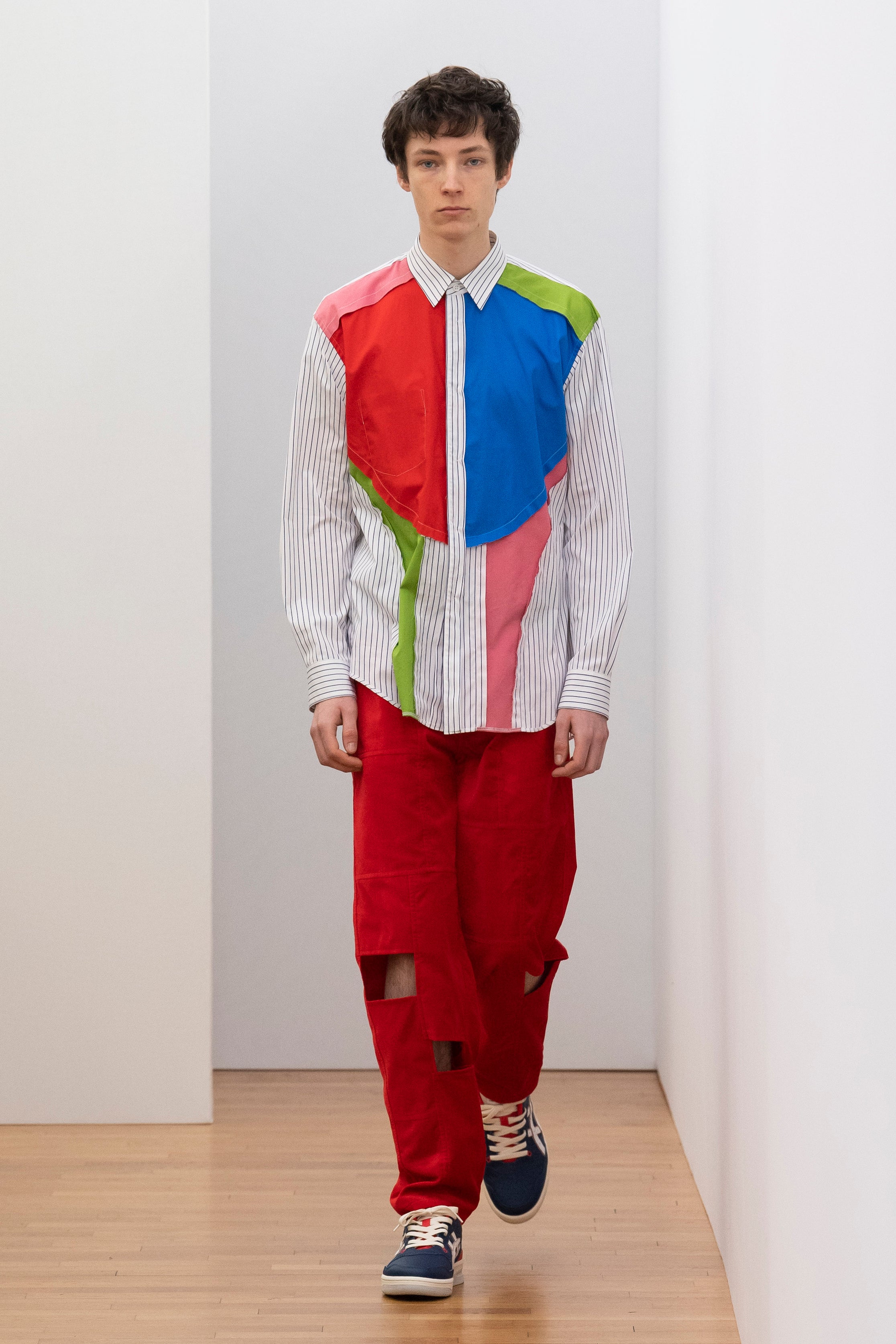 Fashion model wearing a Comme des Garçons Shirt outfit