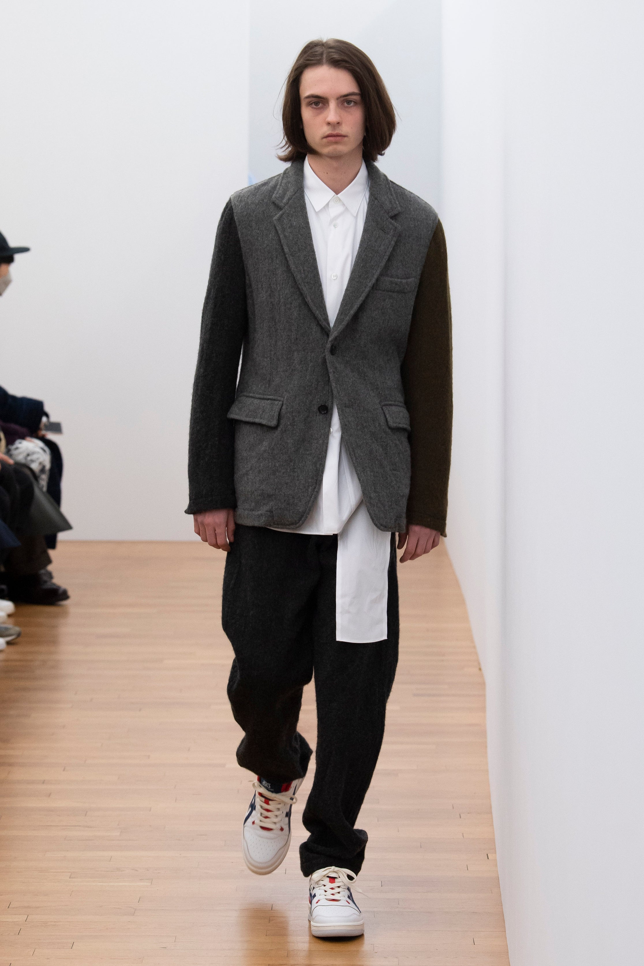 Fashion model wearing a Comme des Garçons Shirt outfit