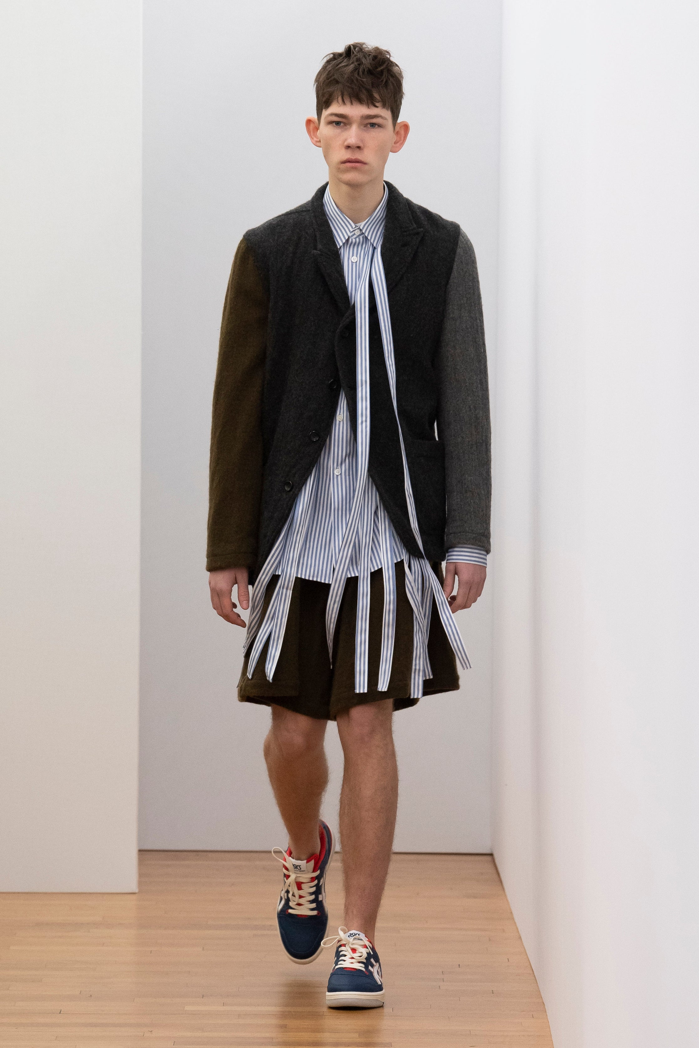 Fashion model wearing a Comme des Garçons Shirt outfit