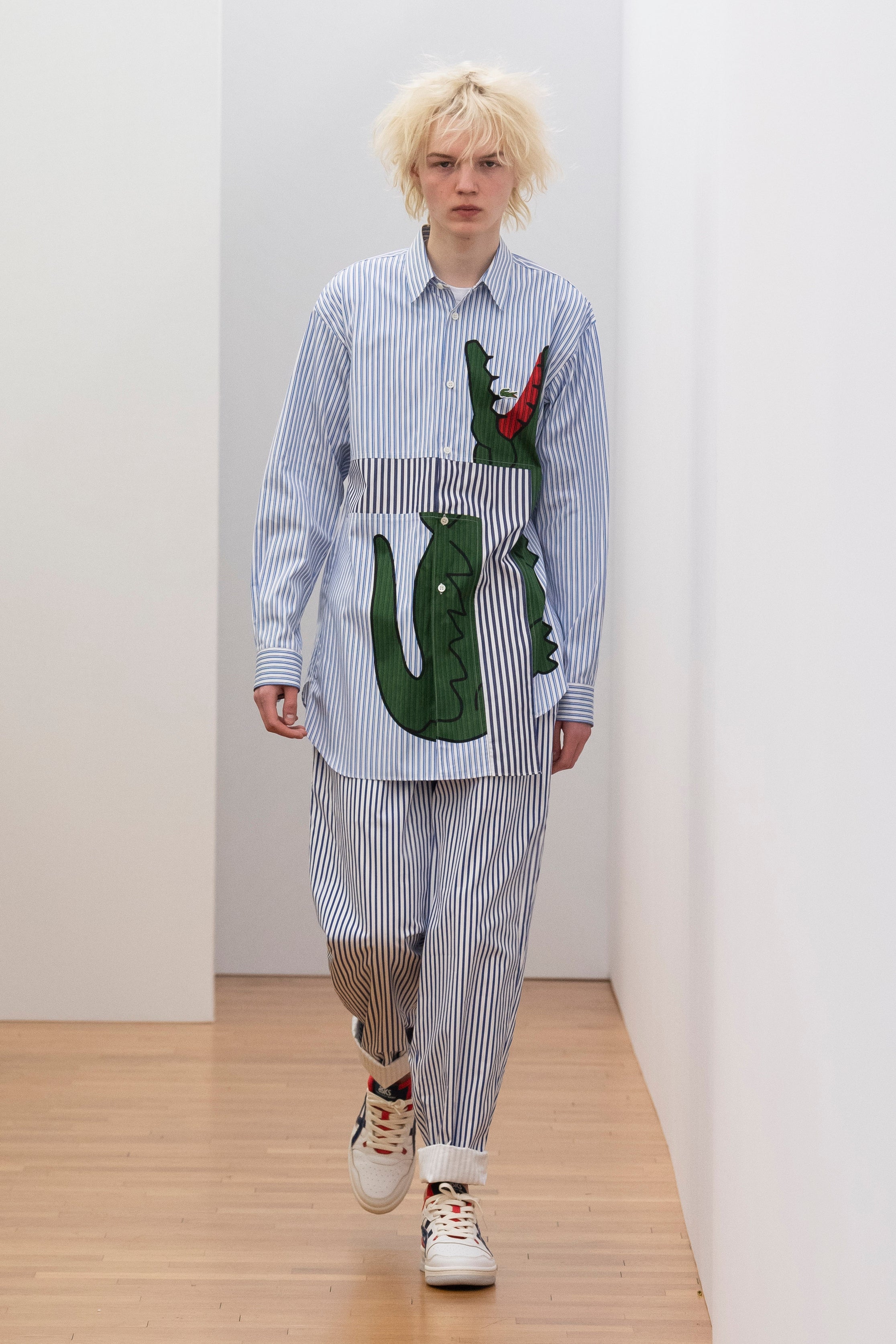 Fashion model wearing a Comme des Garçons Shirt outfit