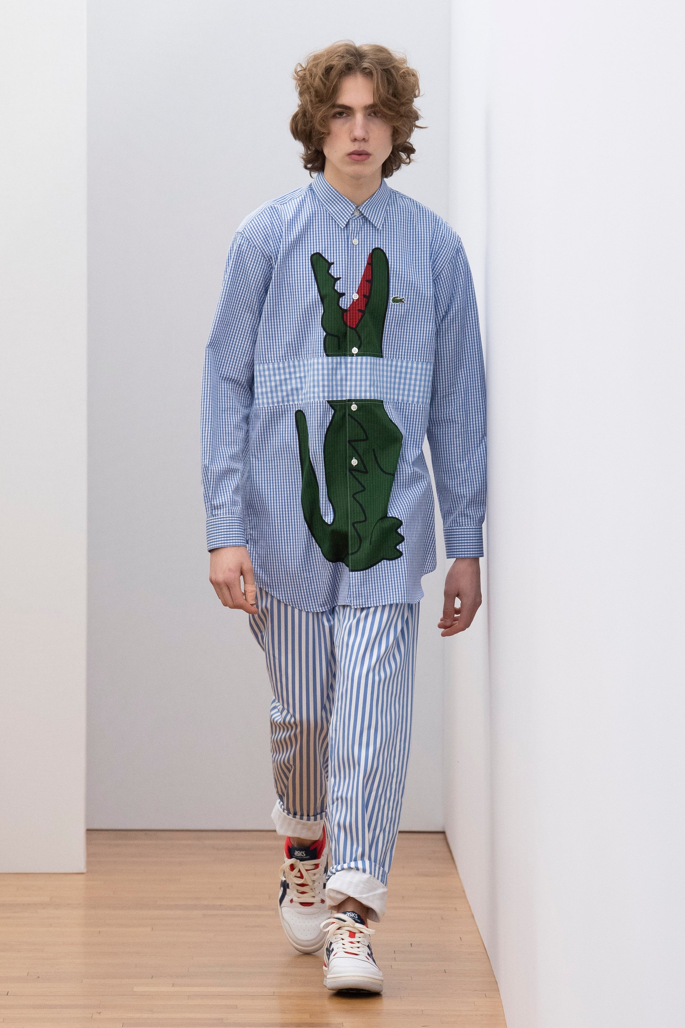 Fashion model wearing a Comme des Garçons Shirt outfit