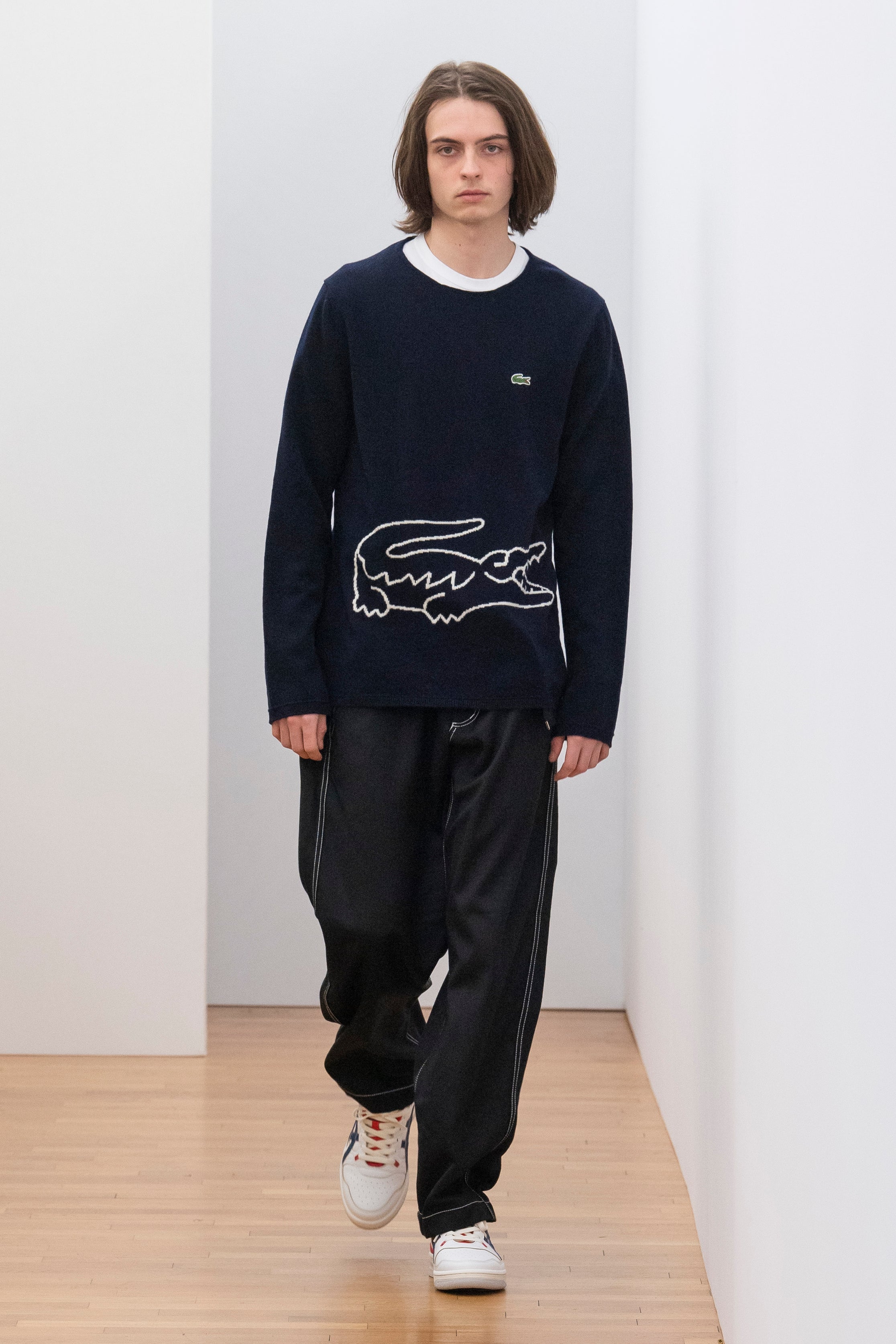 Fashion model wearing a Comme des Garçons Shirt outfit
