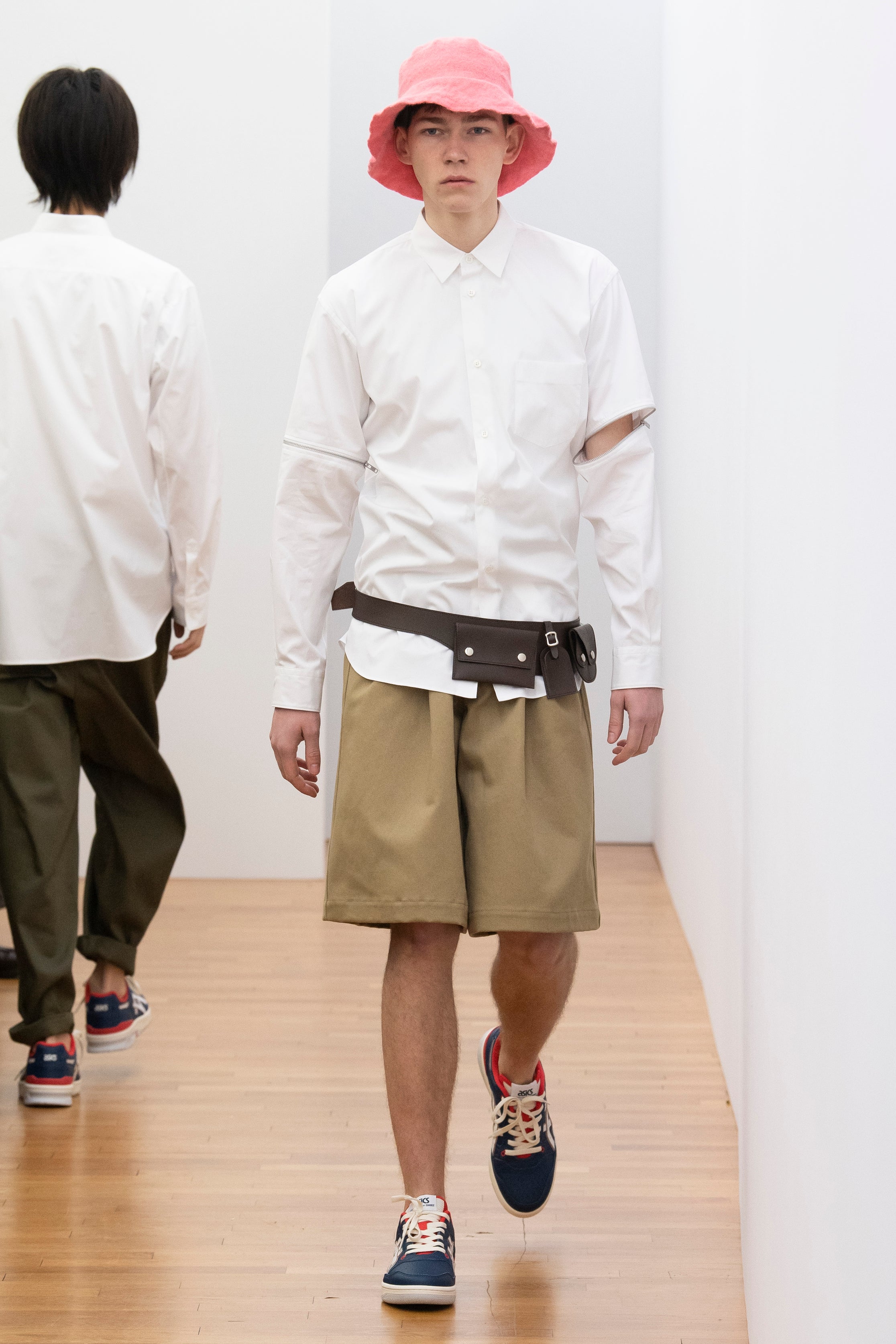 Fashion model wearing a Comme des Garçons Shirt outfit