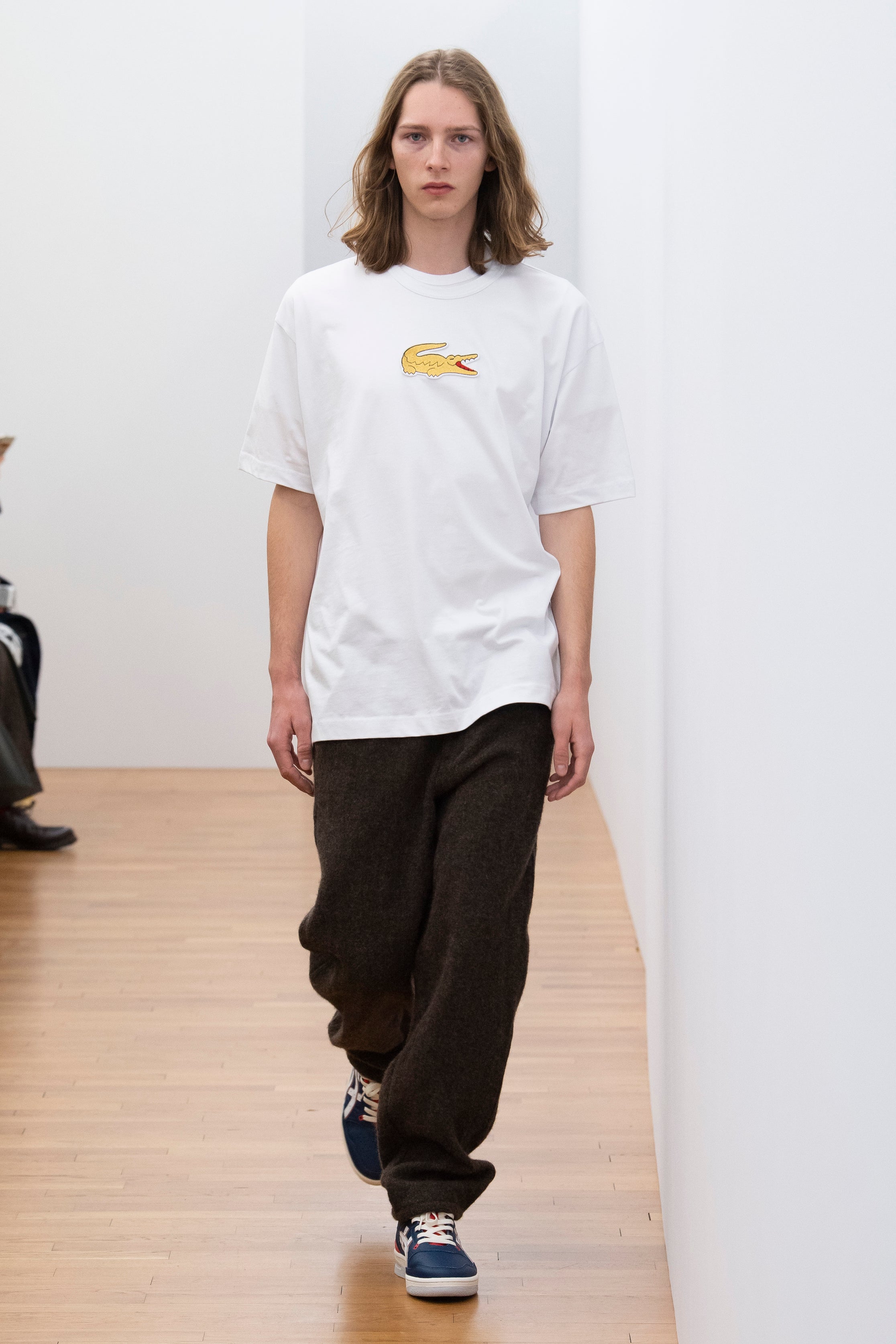Fashion model wearing a Comme des Garçons Shirt outfit