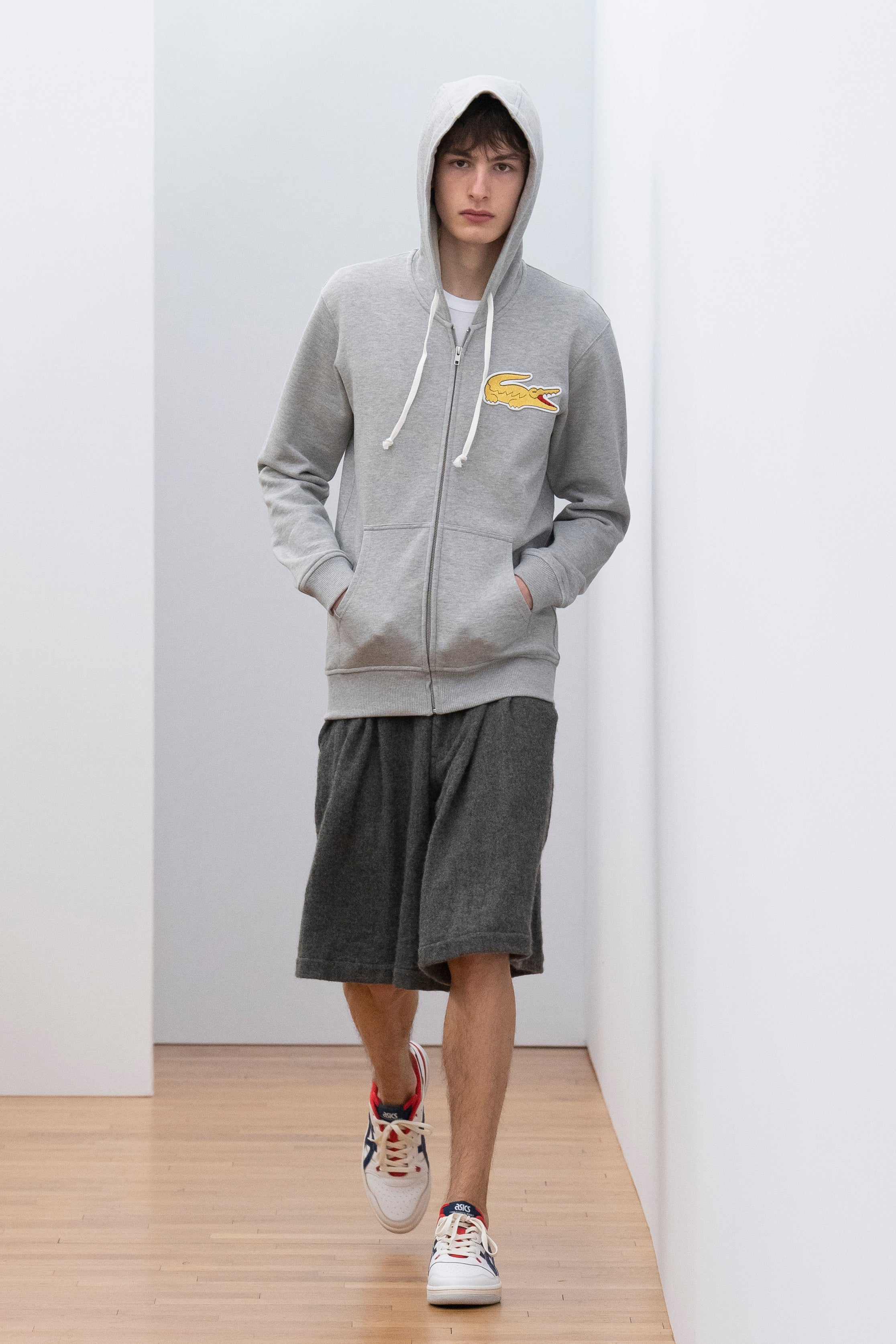 Fashion model wearing a Comme des Garçons Shirt outfit