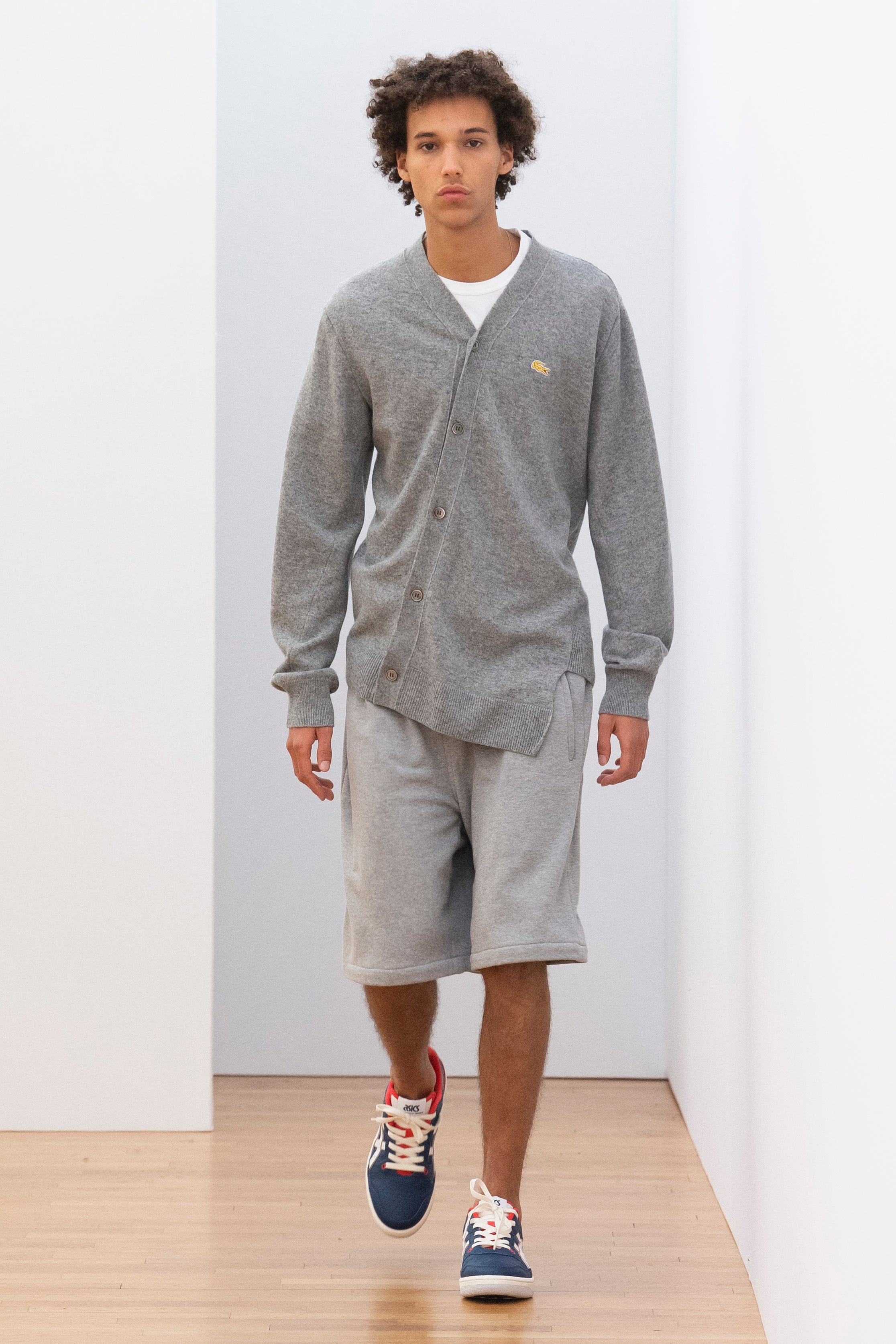 Fashion model wearing a Comme des Garçons Shirt outfit