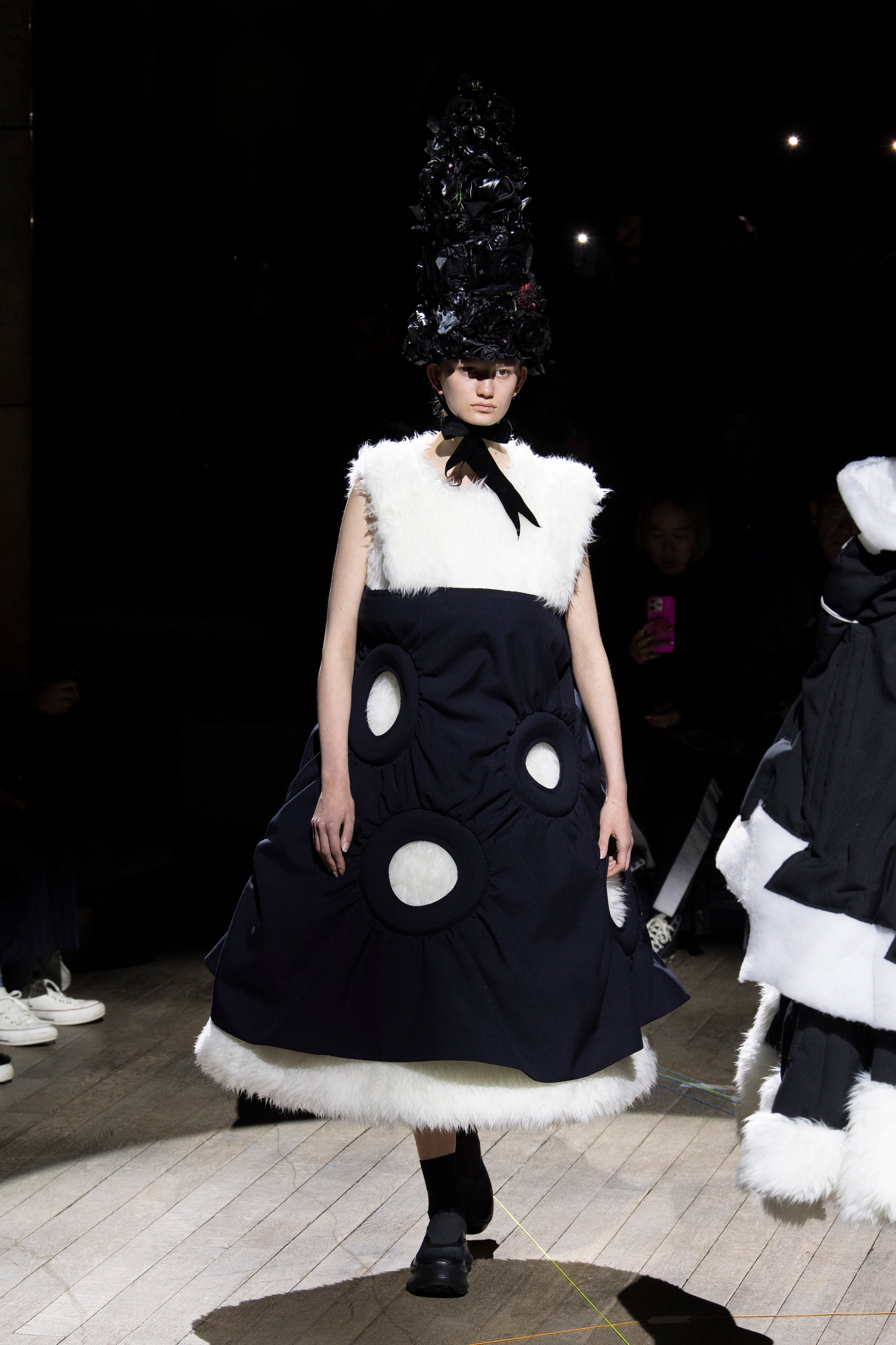 Fashion model wearing a Comme des Garçons outfit