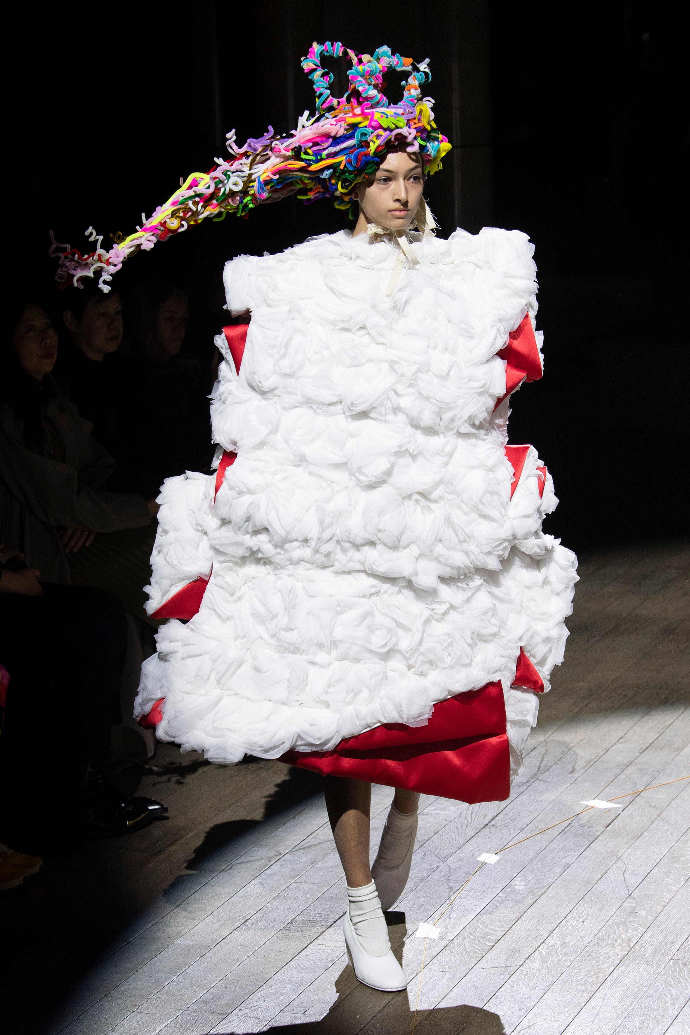 Fashion model wearing a Comme des Garçons outfit
