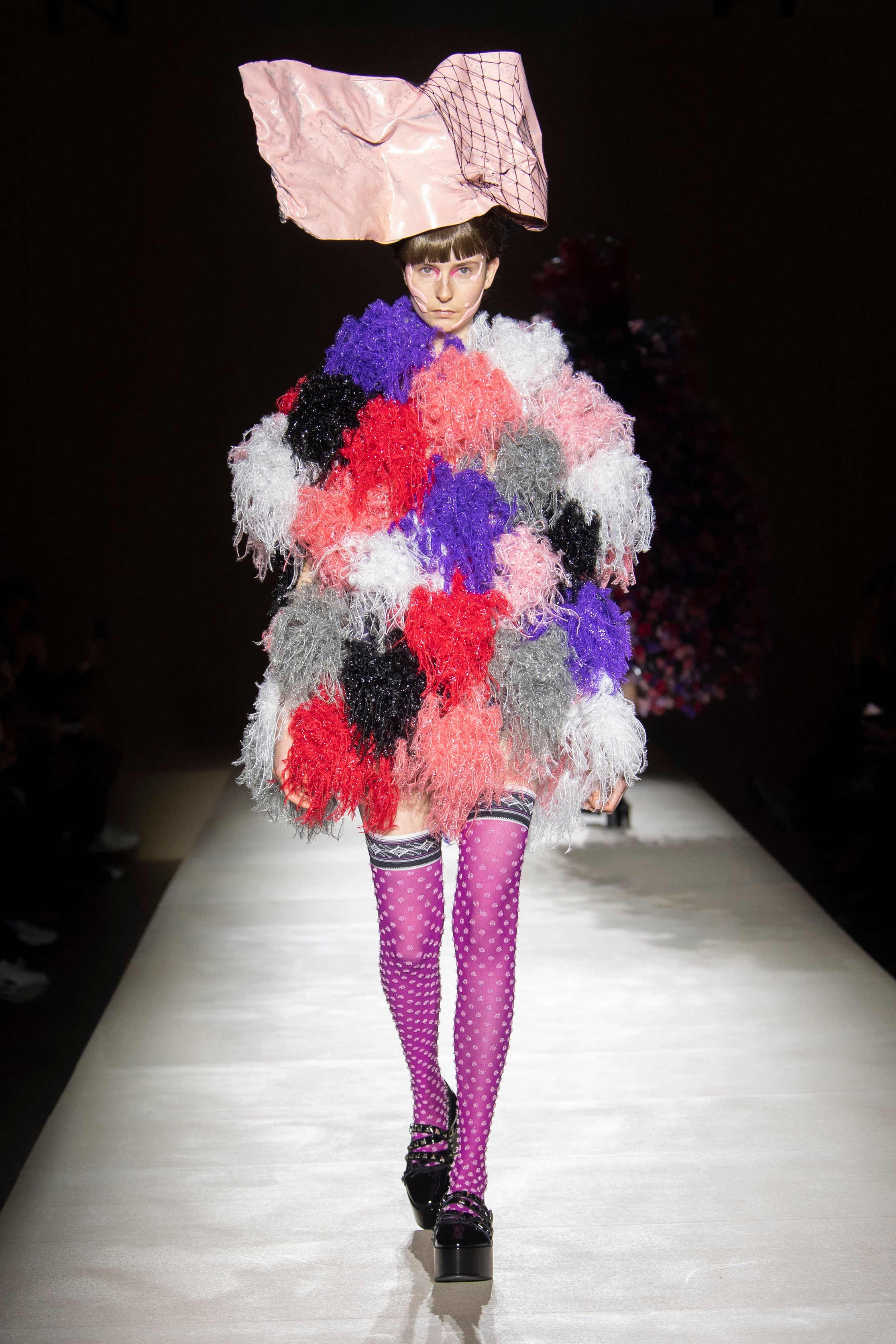 Fashion model wearing a noir kei ninomiya outfit