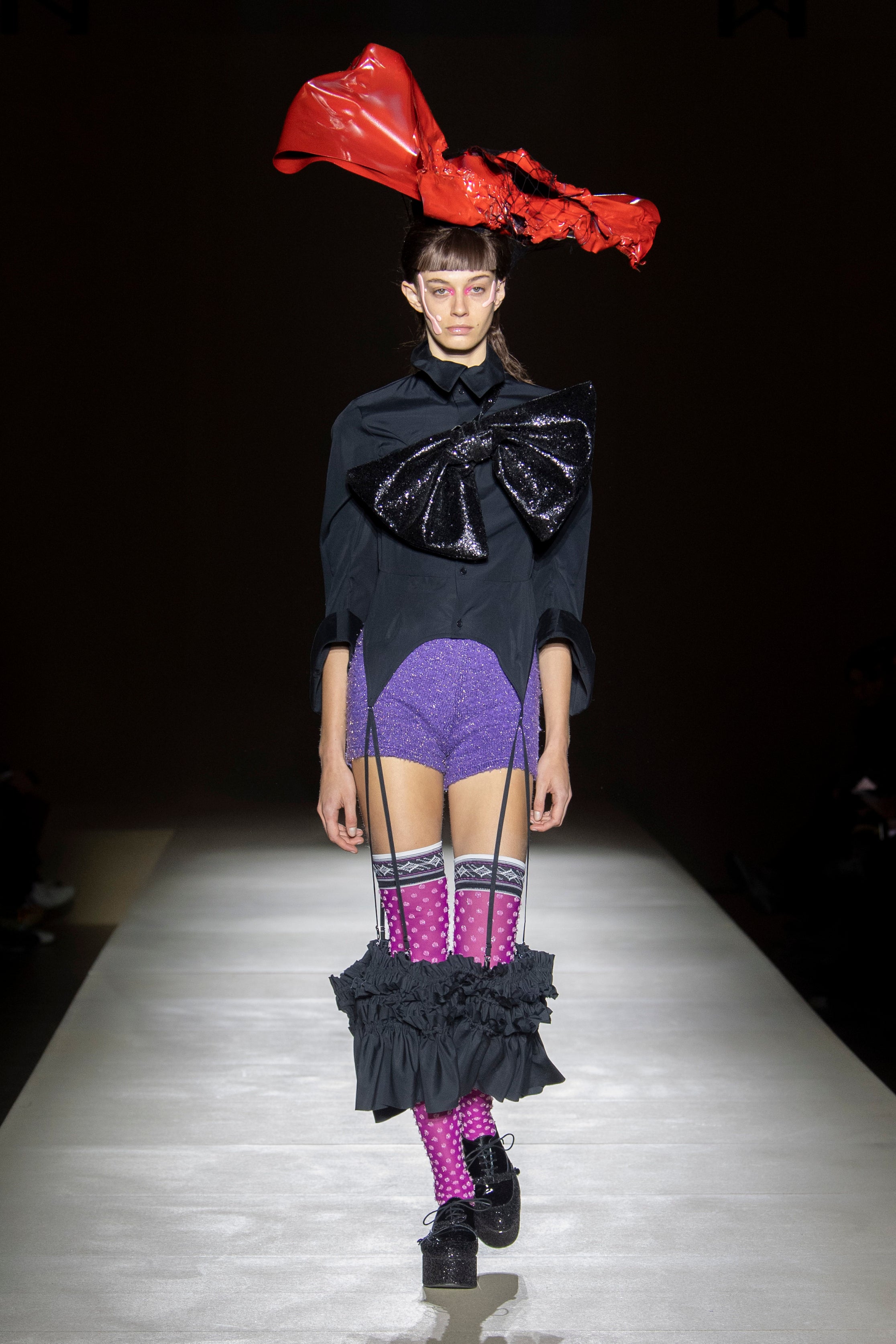 Fashion model wearing a noir kei ninomiya outfit