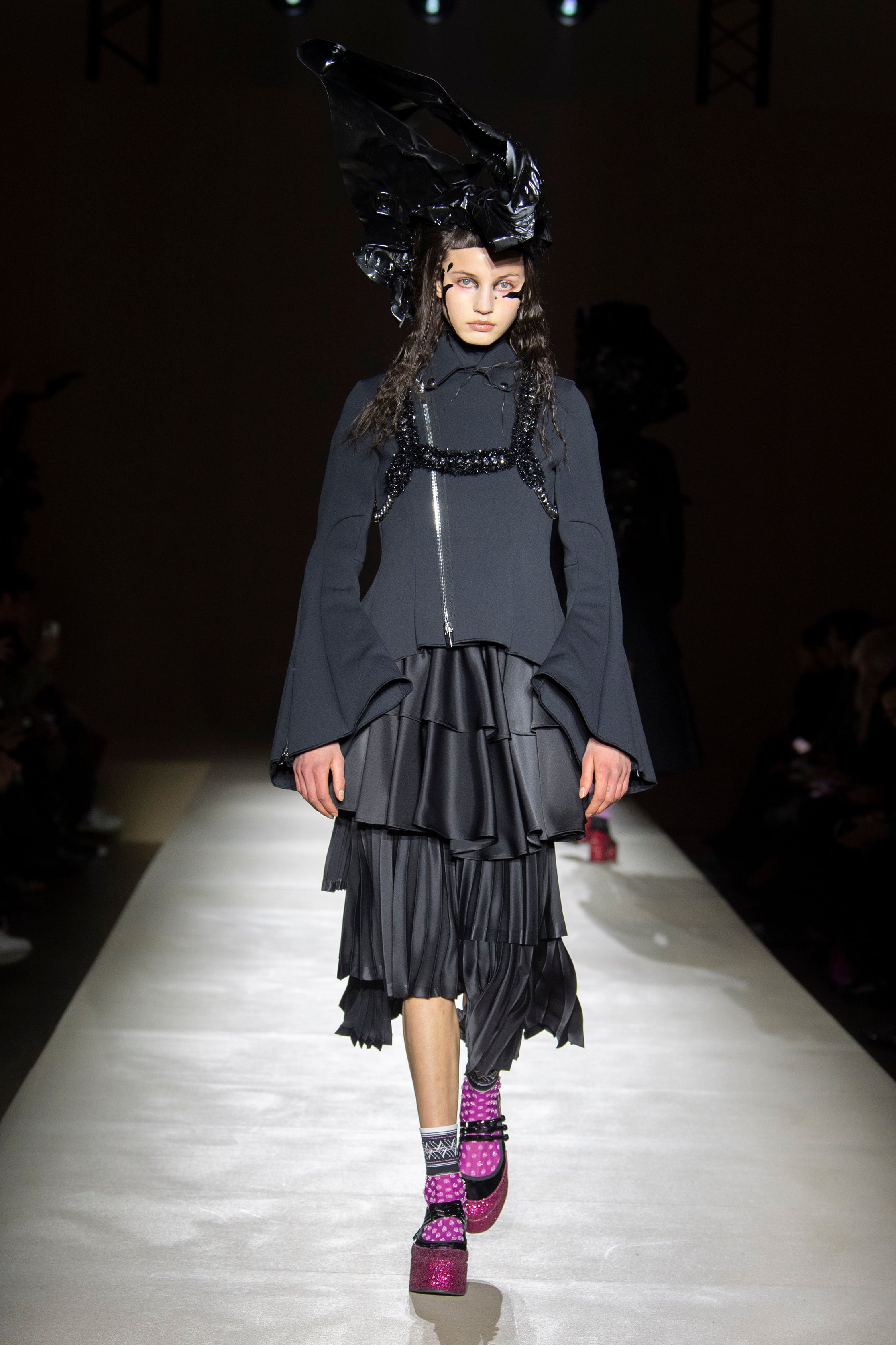 Fashion model wearing a noir kei ninomiya outfit