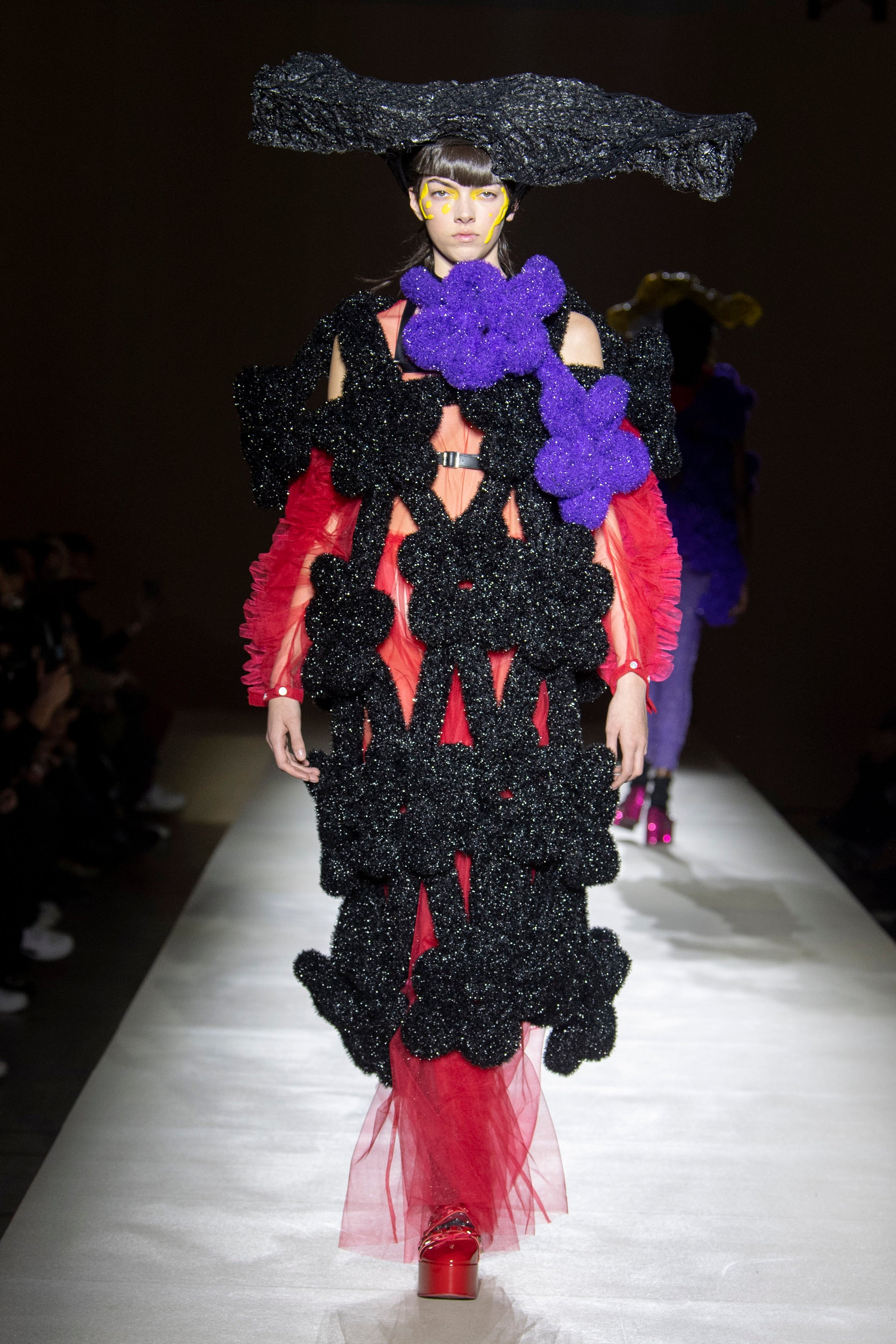 Fashion model wearing a noir kei ninomiya outfit