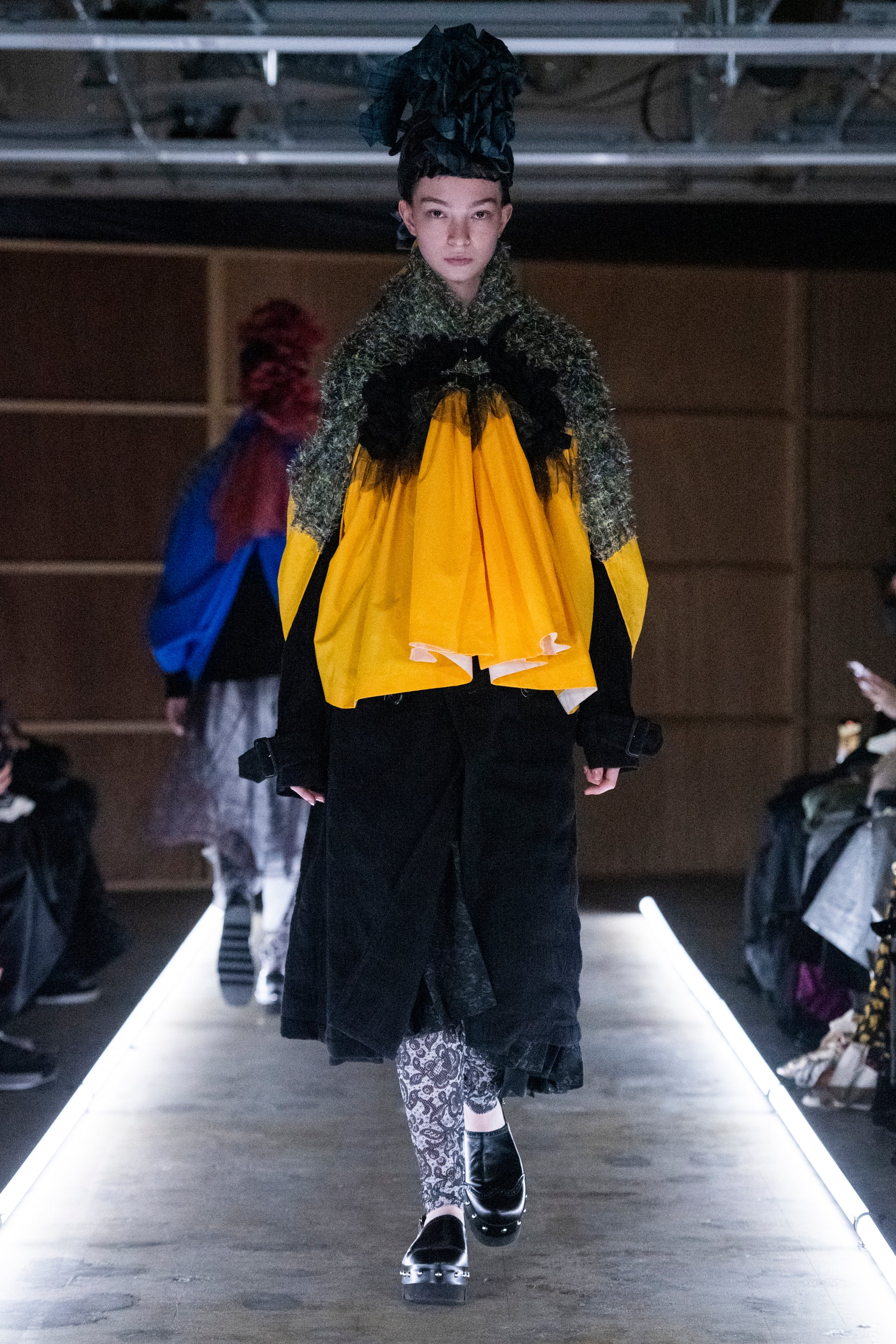 Fashion model wearing a tao outfit