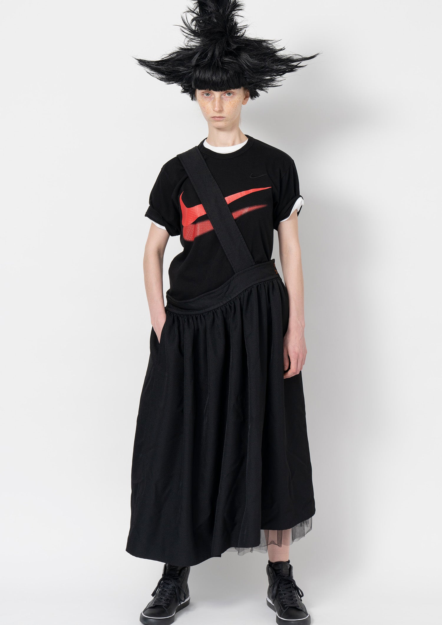 Fashion model wearing a Comme des Garçons Black outfit