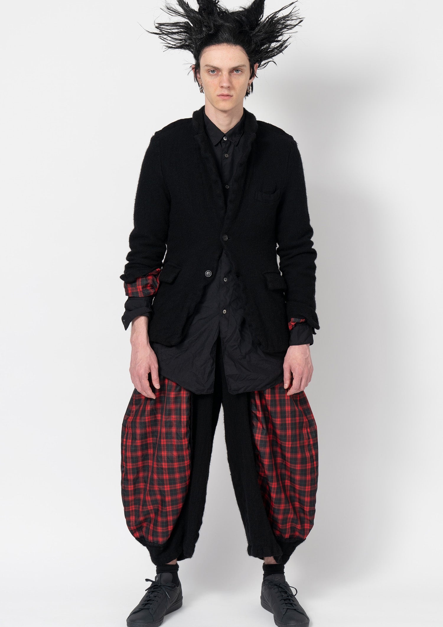 Fashion model wearing a Comme des Garçons Black outfit