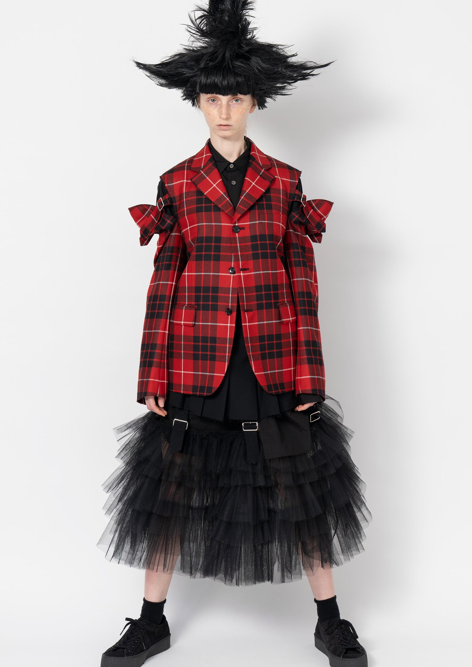 Fashion model wearing a Comme des Garçons Black outfit