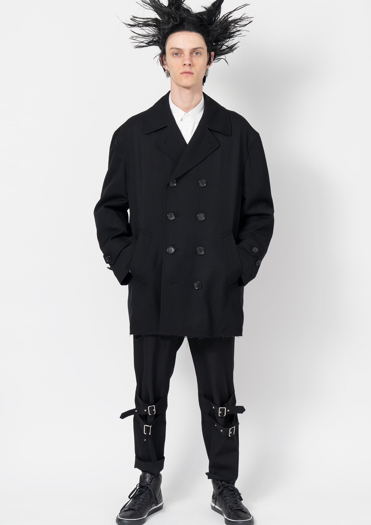 Fashion model wearing a Comme des Garçons Black outfit