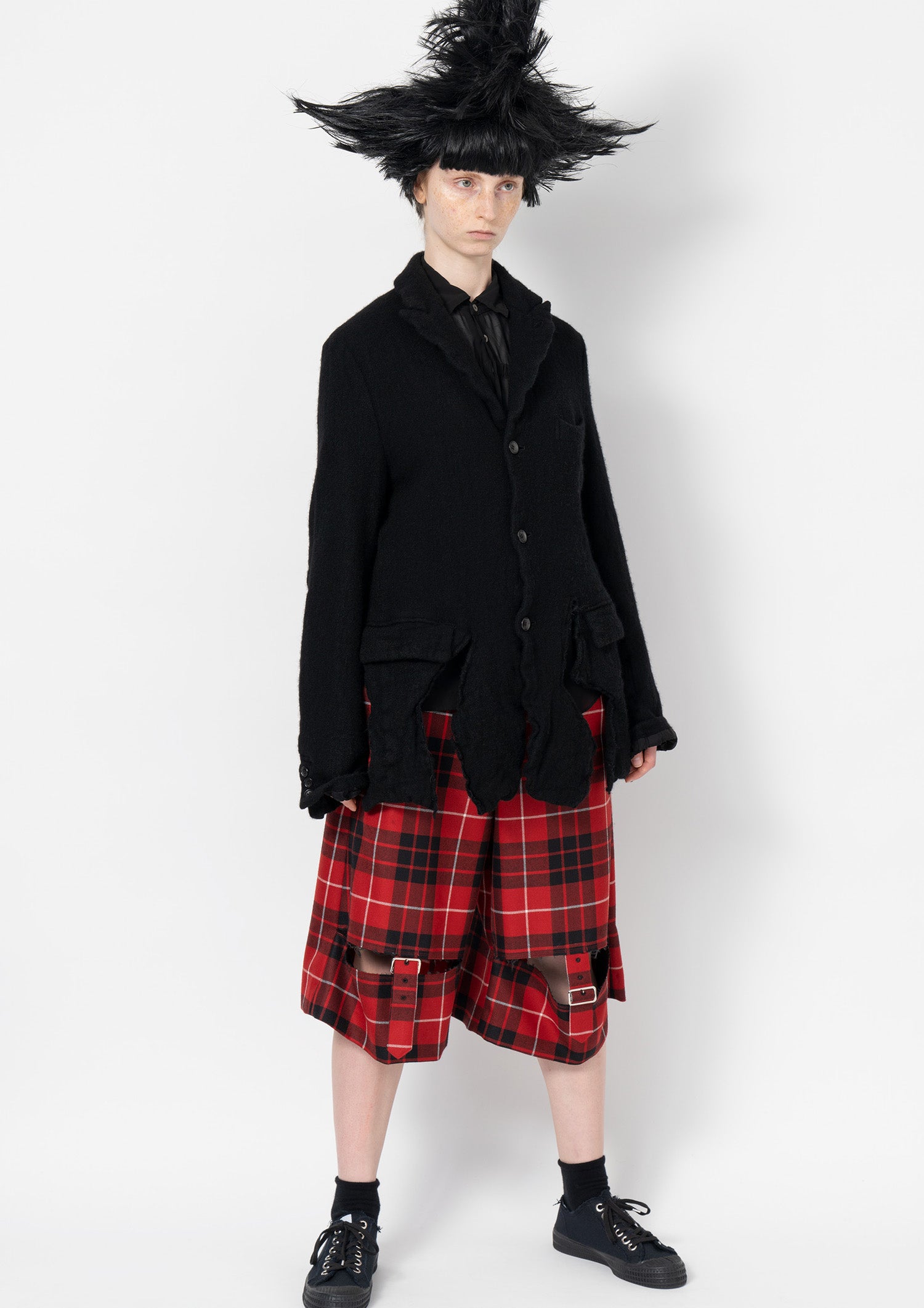 Fashion model wearing a Comme des Garçons Black outfit