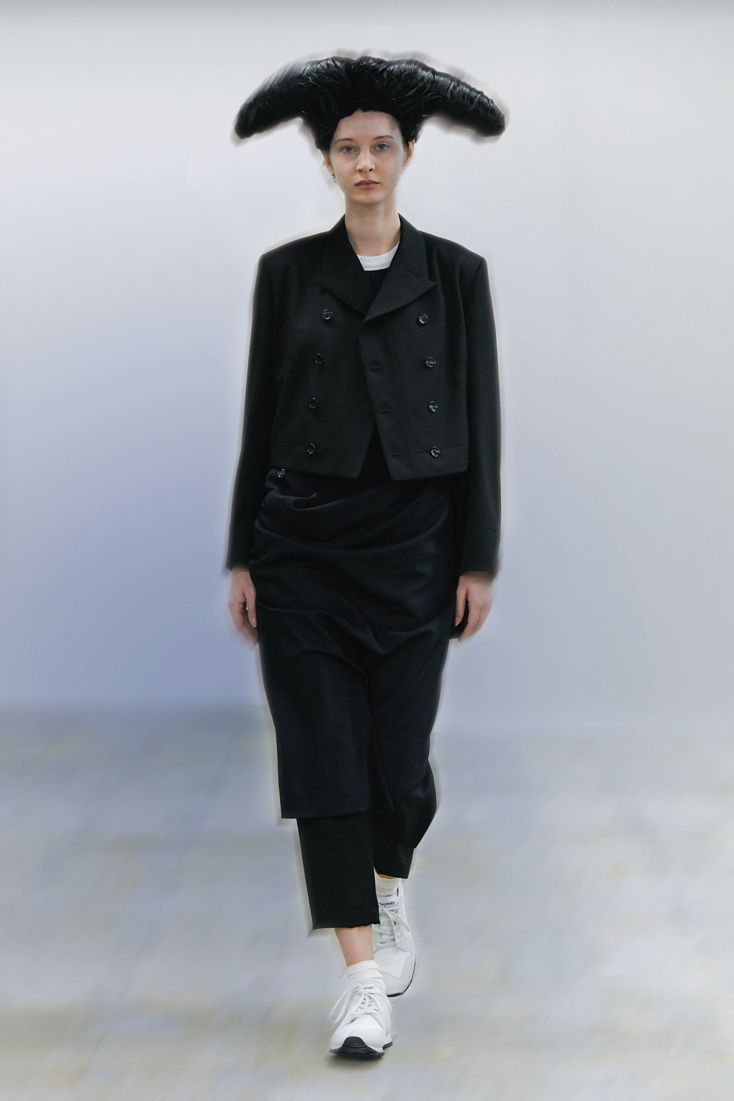 Fashion model wearing a Comme des Garçons Comme des Garçons outfit
