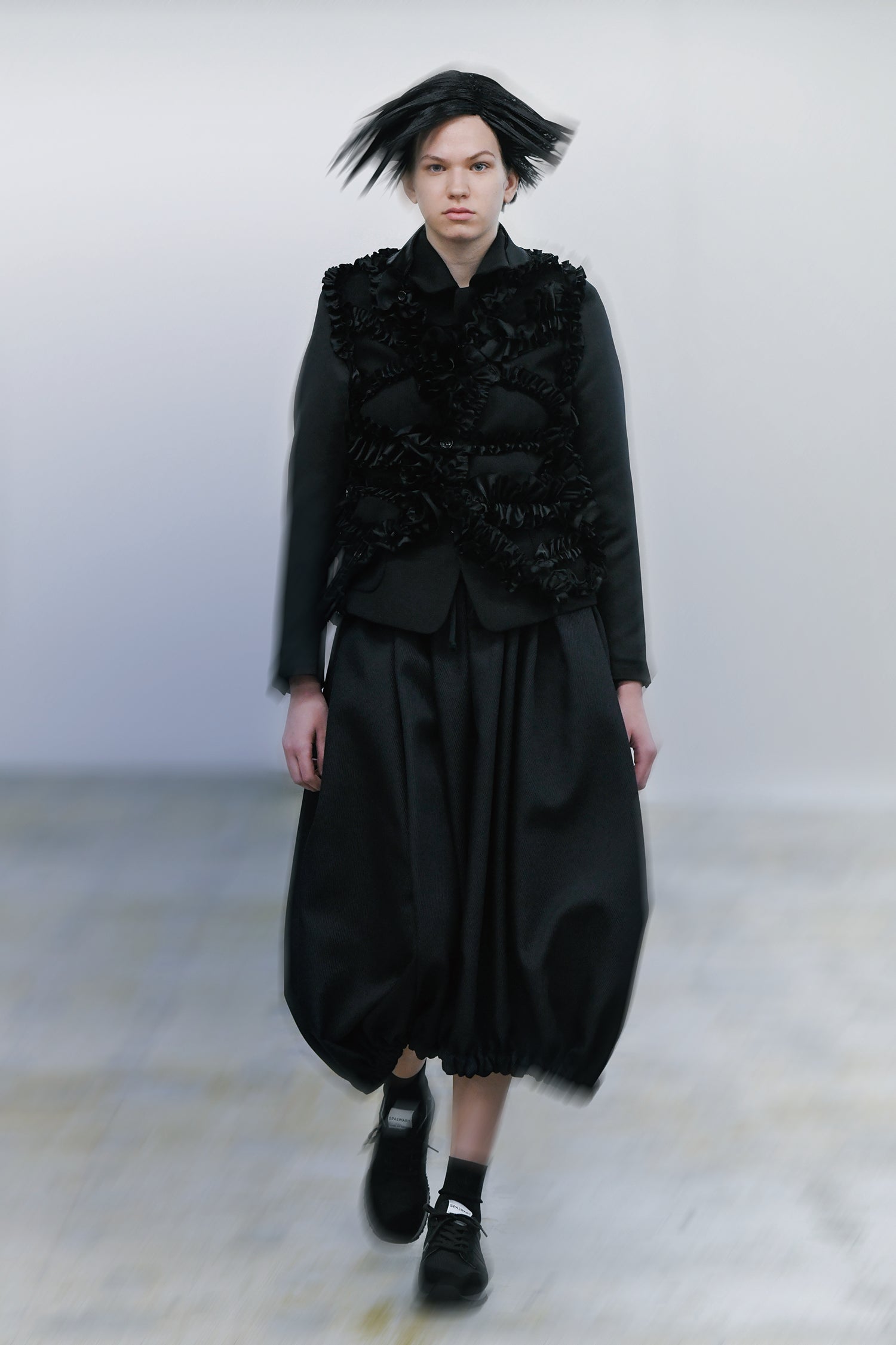 Fashion model wearing a Comme des Garçons Comme des Garçons outfit